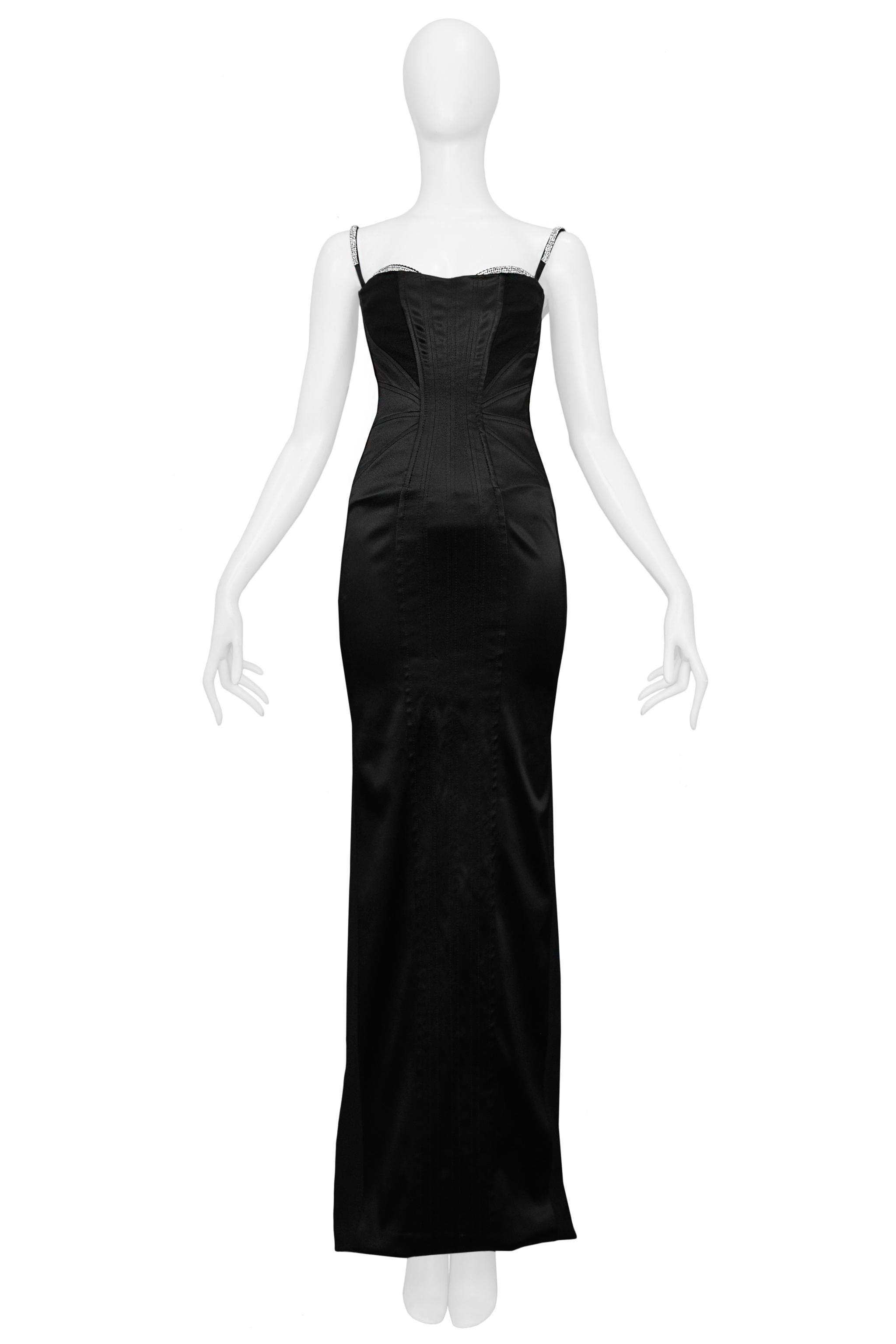 Resurrection Vintage is excited to present a vintage Dolce and Gabbana black satin evening gown featuring an attached bra with rhinestone trim, rhinestone-covered adjustable straps, a rhinestone-covered zipper pull, dramatic stitching, leopard print