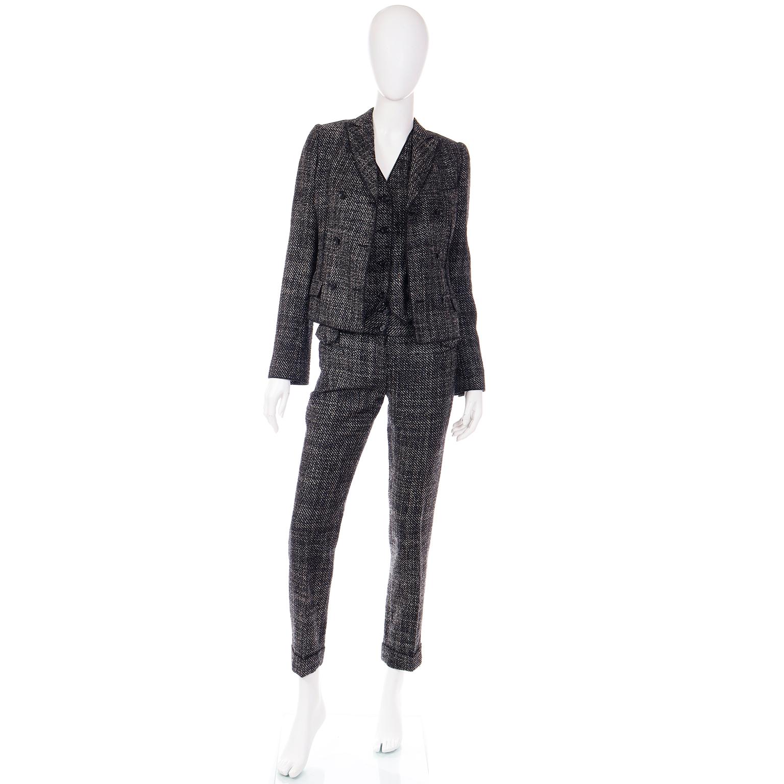 This is an early 2000's Dolce & Gabbana 3 piece white and charcoal tweed textured Nylon/Silk/Wool/Alpaca blend suit consisting of trousers, a vest, and a jacket. We love suits because they offer so many wearable options and fun ways to mix pieces