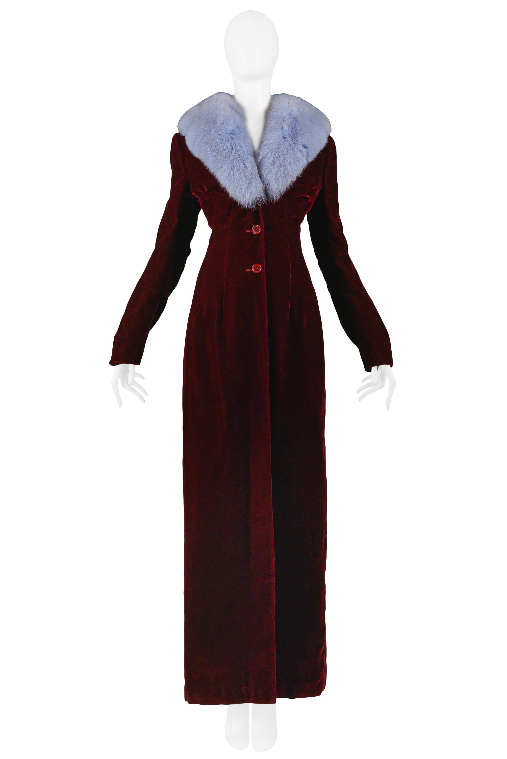 Vintage Dolce & Gabbana burgundy velvet long coat featuring a periwinkle blue fur collar and center front button closure. Collection 1997.

Excellent Vintage Condition.

Size 42.
 
Measurements: Shoulder 16