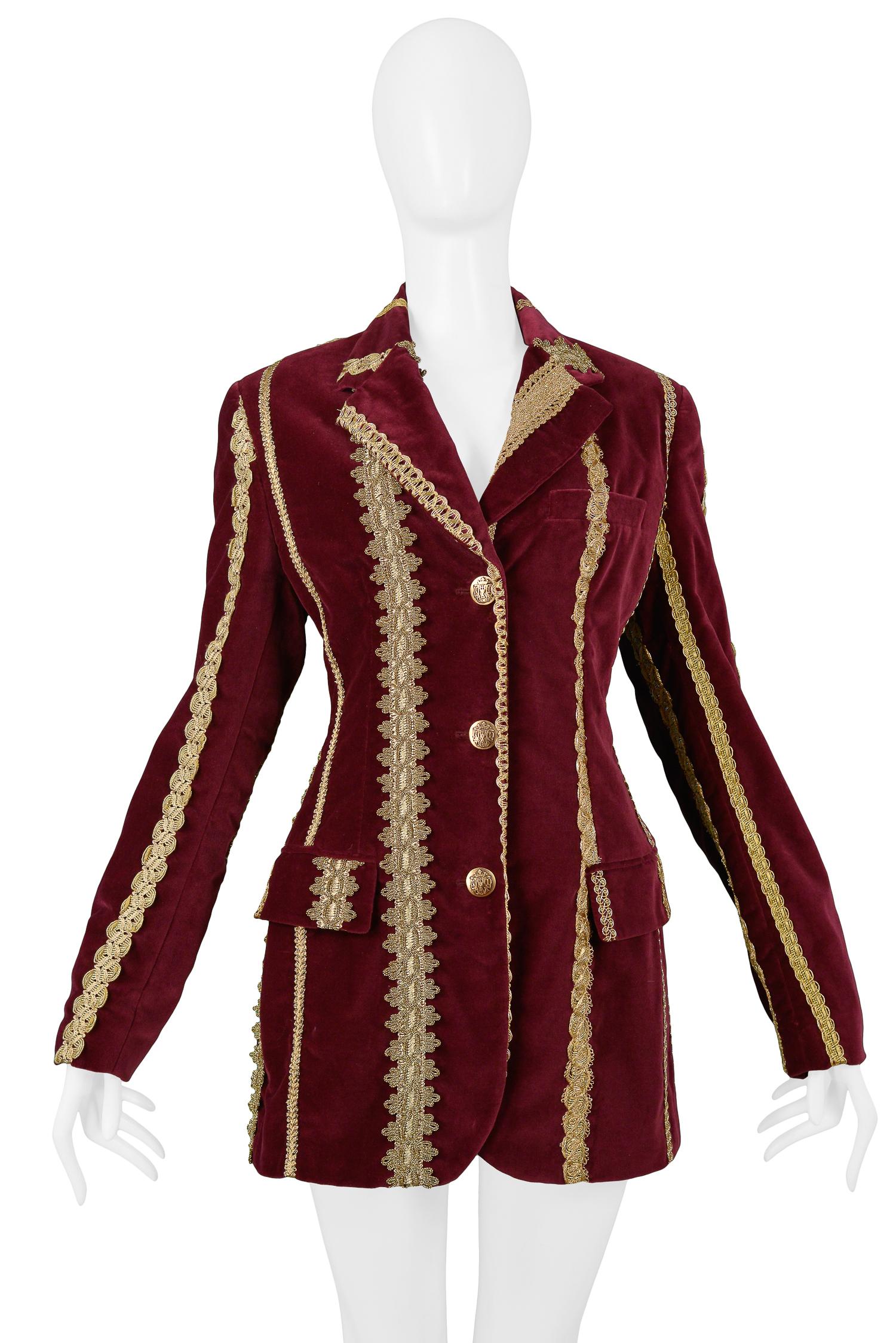 Vintage Dolce & Gabbana burgundy velvet jacket with gold buttons, trim, and piping. Collection AW 1993.

Deadstock.

Size IT 44