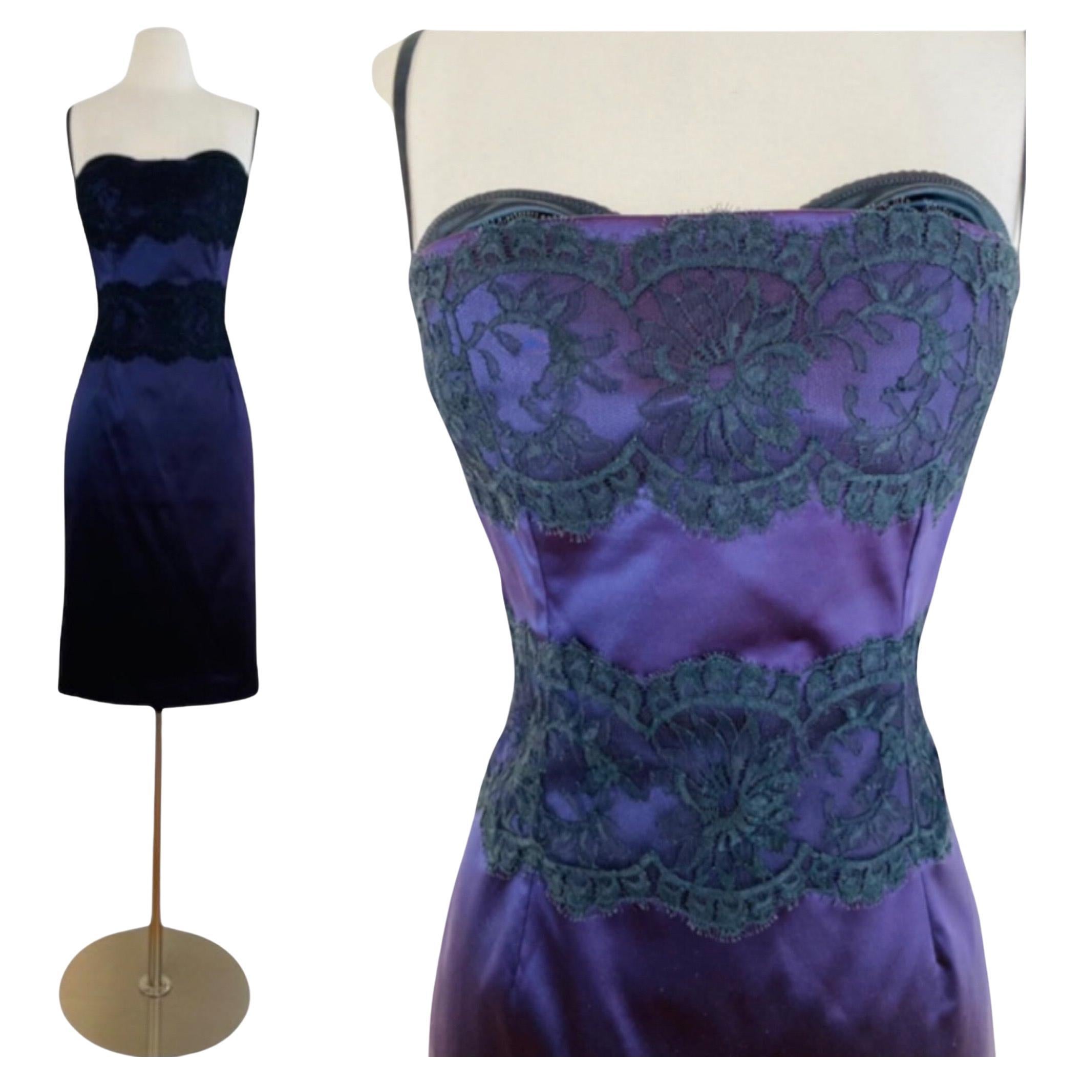 Beautiful  Dolce + Gabbana Dress
Deep purple silk + elastane fabric
Built in black bra with adjustable shoulder straps
Bodice cuts straight across with thick band of black eyelash lace accent
Fitted wiggle style
Wide band of black eyelash lace at