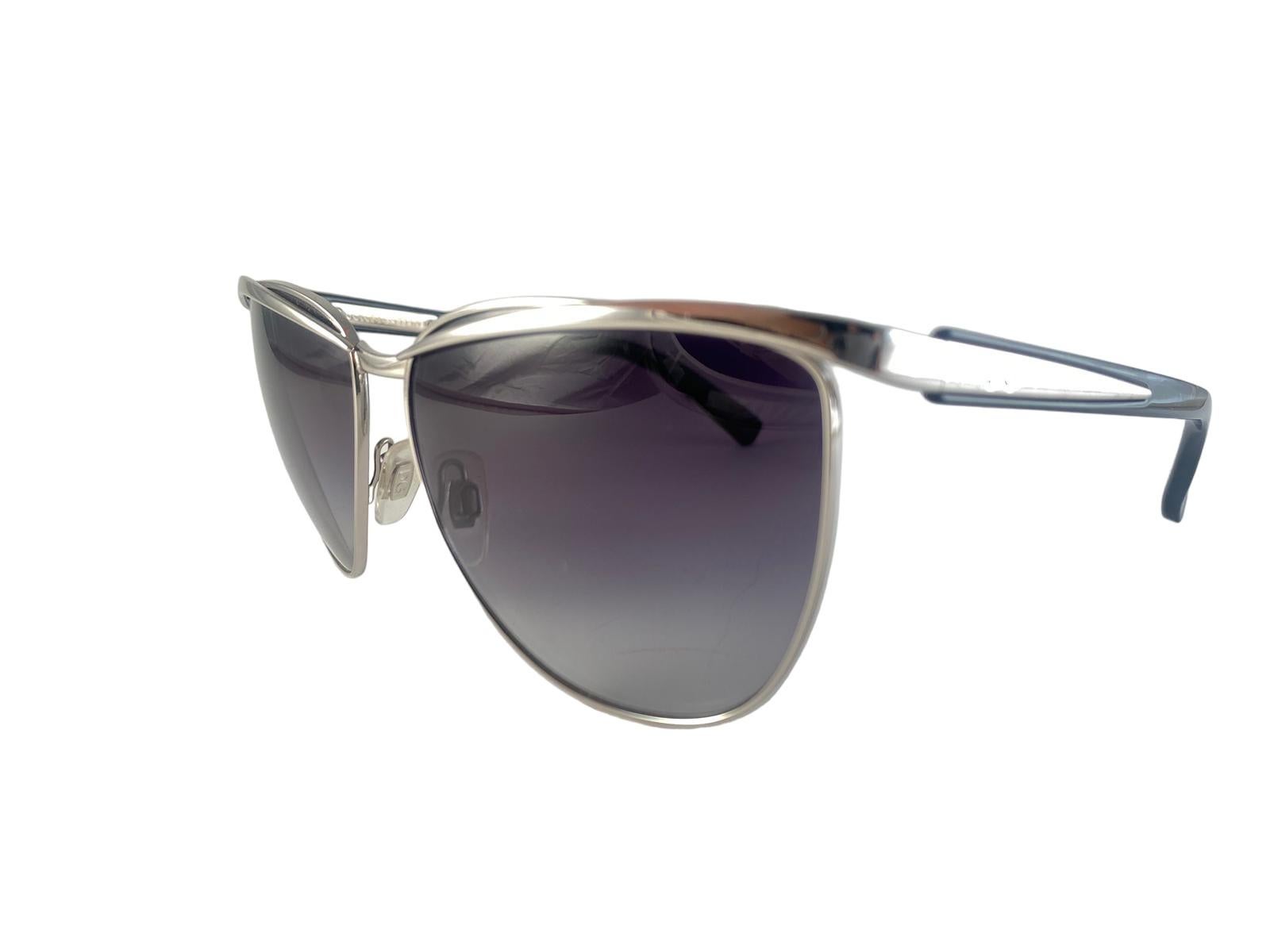 Vintage Dolce & Gabbana X Madonna Dg 2087 Silver 2010 Sunglasses Italy

Eye Catching Dolce & Gabbana In Collaboration With Madonna.

Whimsical Silver Frame Holding A Pair Of Blue Lenses. Madonna Engraved On The Inside Of The Left Temple.
New! Never