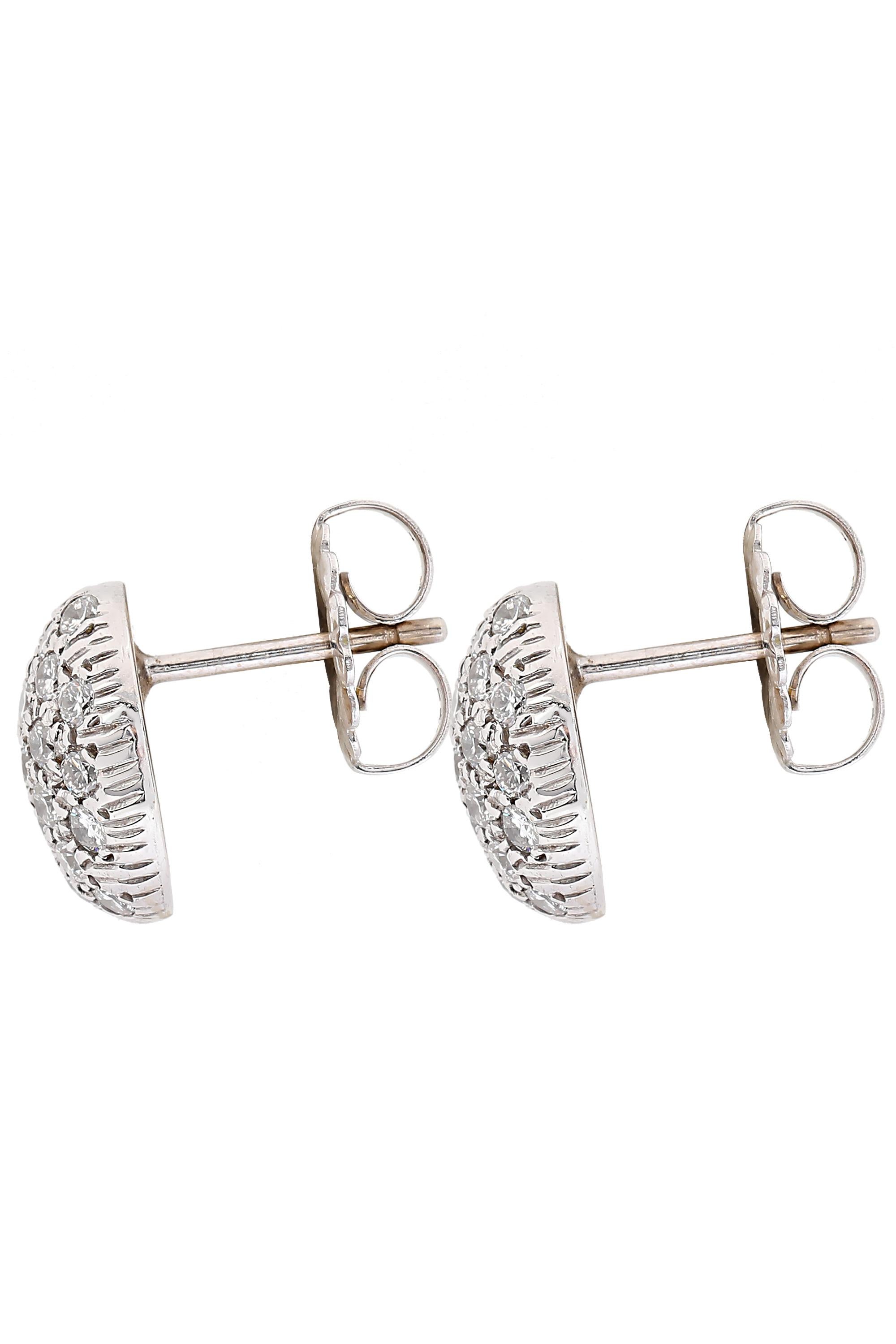 These delightful vintage 14 karat white gold diamond cluster earrings glitter with approximately 1.85 carats of round brilliant diamonds G-H color and VS clarity. The domed pave diamond earrings measure 0.5 inch long.

Gemstone: Diamond
Cut: Round