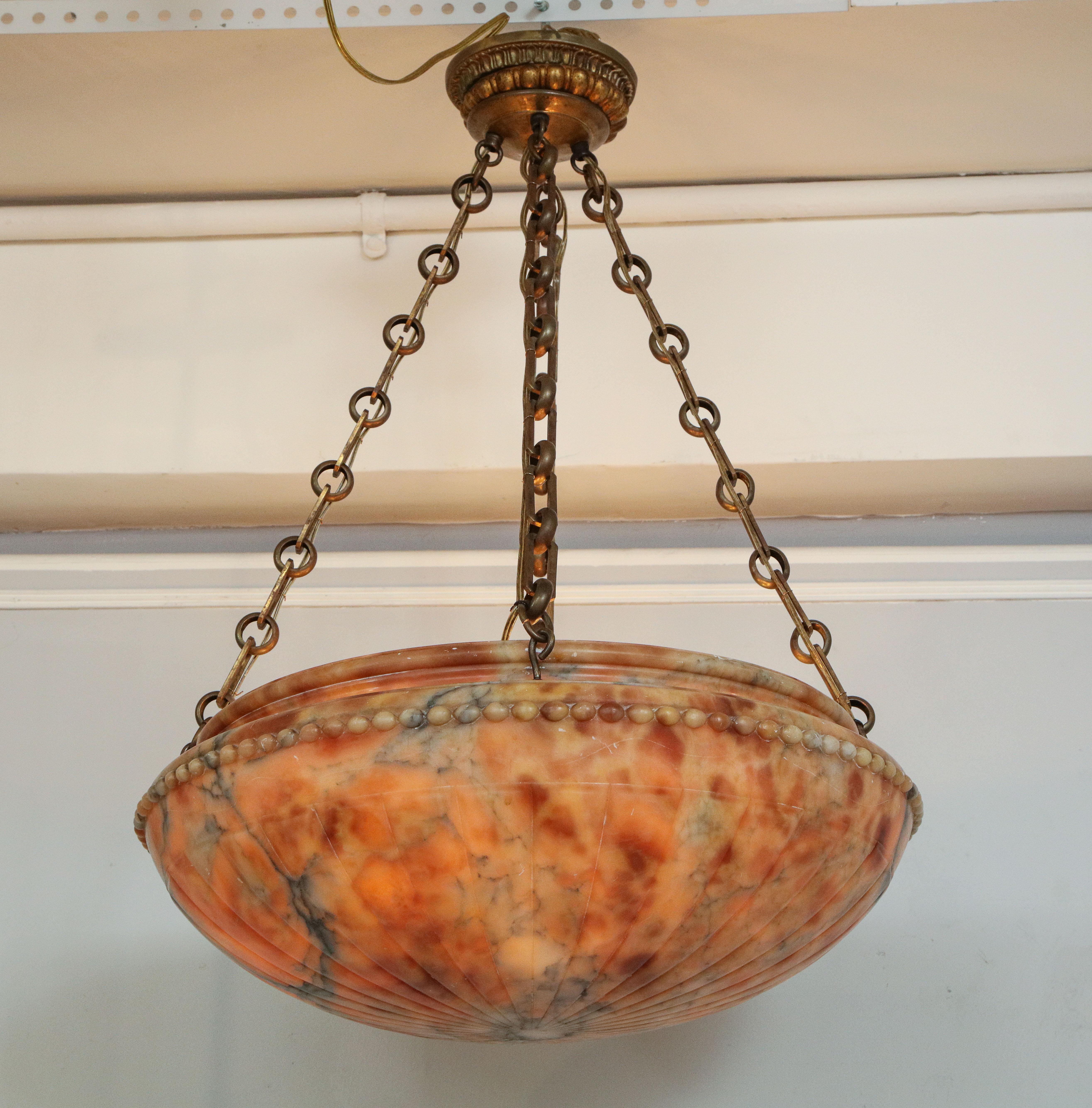 Amber-colored alabaster pendant in the neoclassic manner with egg and dart relief.