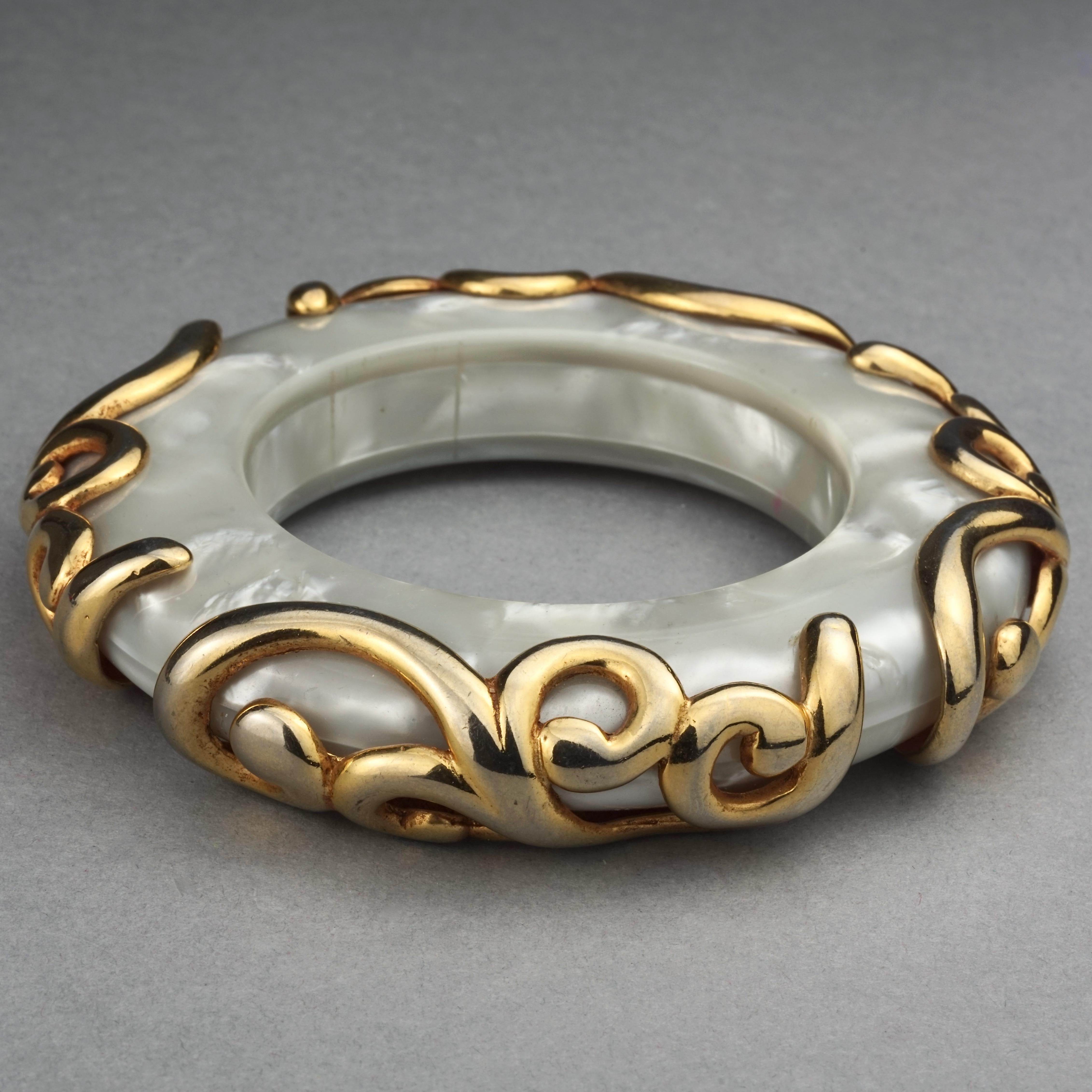 Vintage DOMINIQUE AURIENTIS Gilt Swirl Mother of Pearl Resin Bangle Bracelet For Sale 1