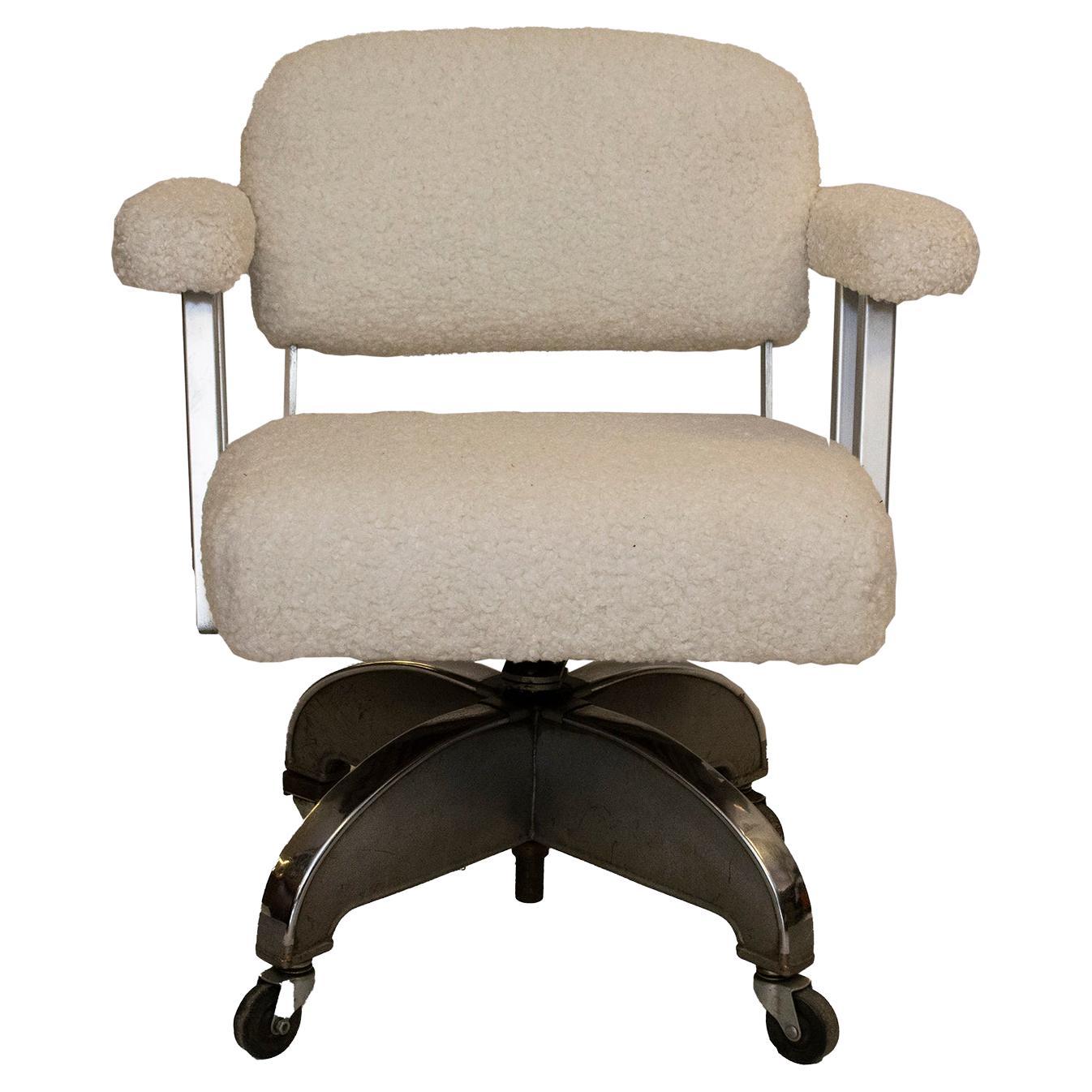 Vintage DoMore office swivel chair upholstered in white faux shearling. The white faux shearling upholstery offers a appealing contrast to the Industrial look of this chair. This vintage swivel chair would be suitable for the office or at home