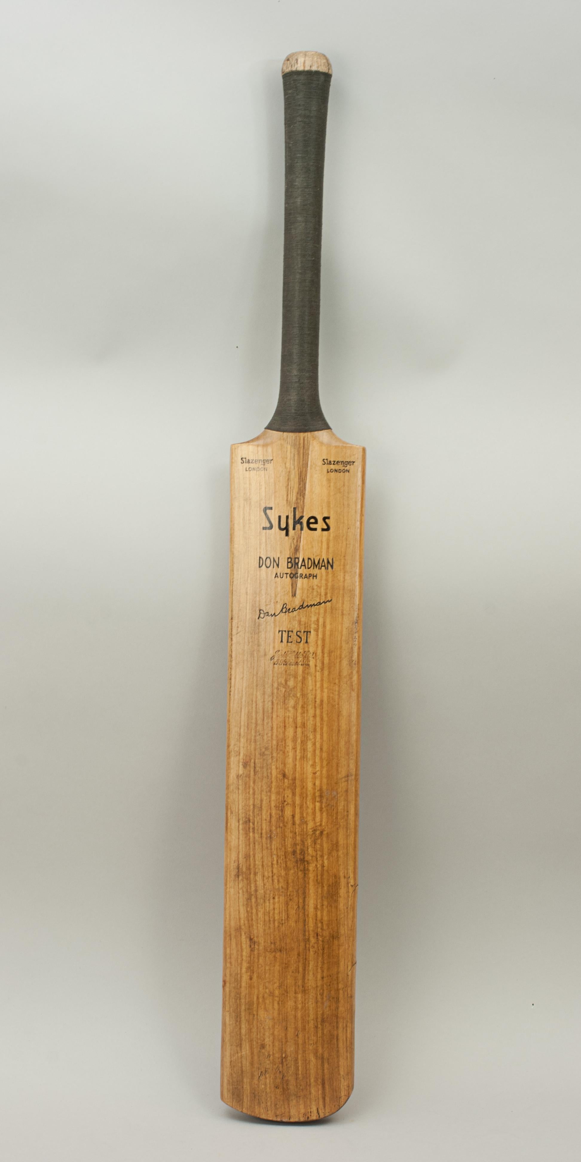 Sykes 'Don Bradman' Autograph Cricket Bat.
A fine Sykes, Slazenger 'Don Bradman' autograph cricket bat. The blade is clean and in very good condition with a cord strung grip and triple sprung handle. The shoulders are embossed 
