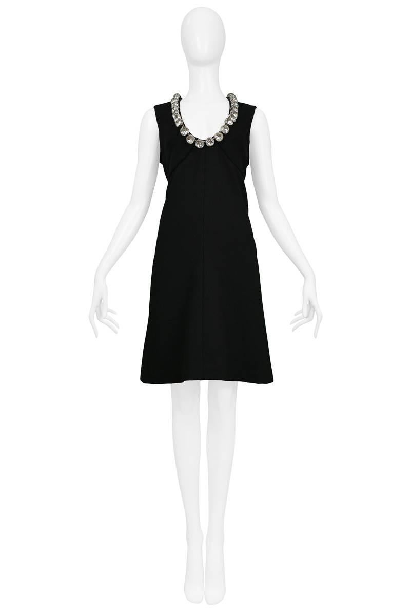 Vintage Donald Brooks black sleeveless cocktail dress with large clear crystal jewel neckline featuring button closure at back. Please contact us for measurements. 

Condition : Excellent Vintage Condition