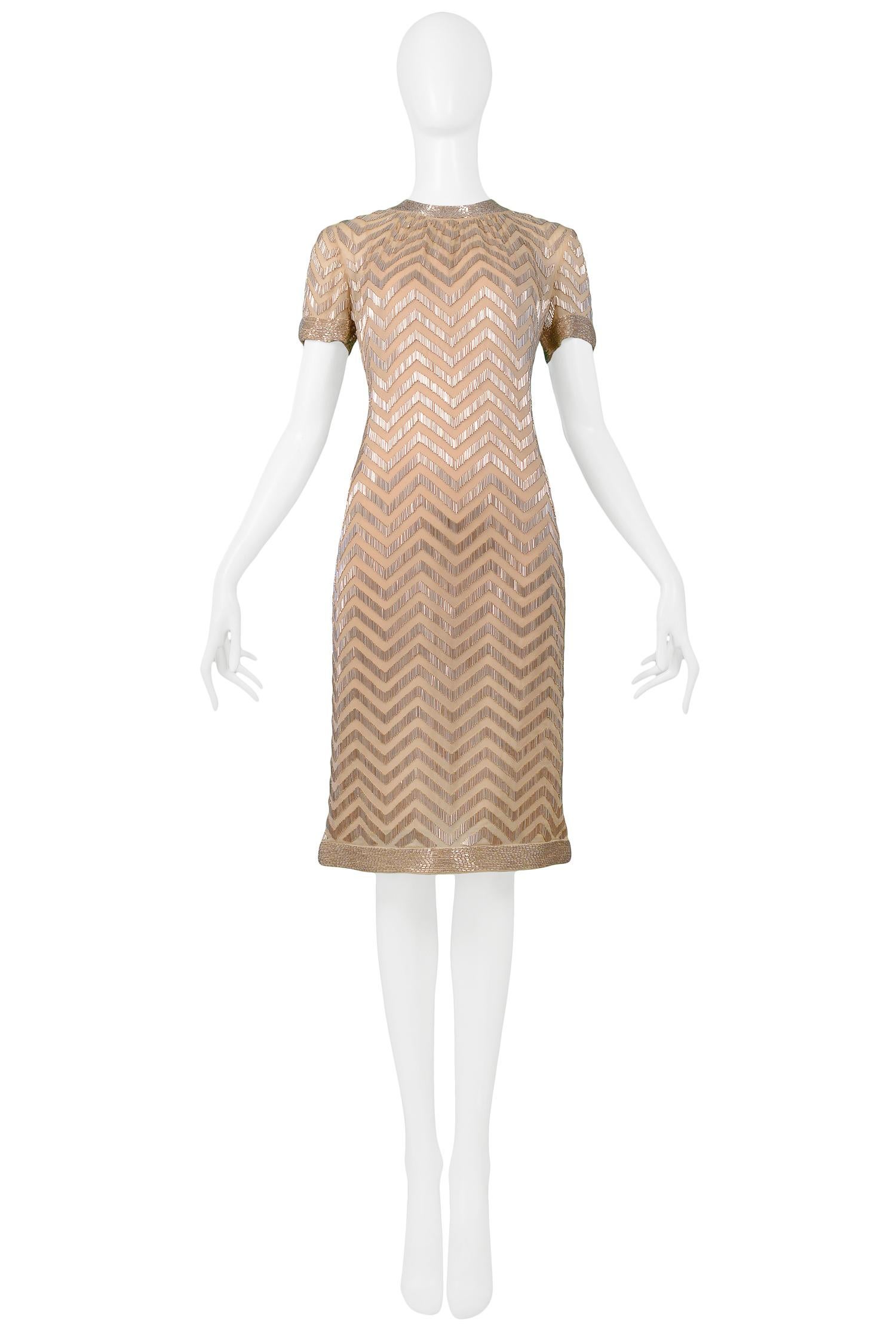 Vintage Donald Brooks short sleeve cocktail dress featuring gold chevron pattern beading atop a nude chiffon lining and back zipper closure. Circa 1960's.

Excellent Vintage Condition
Size 2