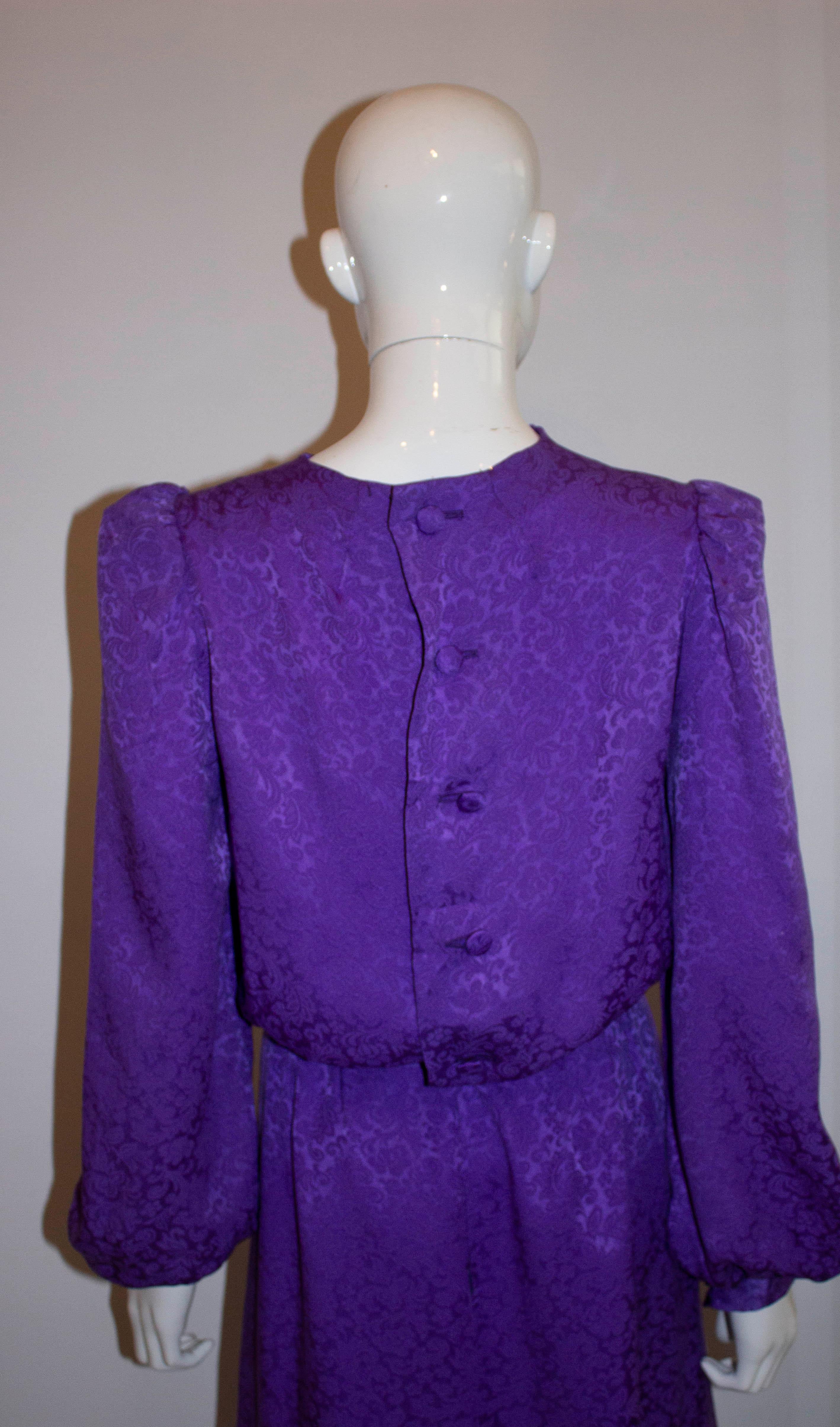 A chic vintage silk dress by Donald Campbell. As you would expect the silk is super soft with a wonderful texture. The upper area of the dress is unlined, and the skirt area lined. It has a button opening on the back top area and zip opening on the