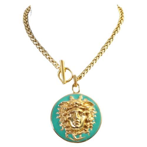 Vintage Donald Stannard Gold Tone Enamel Turquoise Medusa Circa 1980s. This turquoise enamel pendant with a 3d Medusa pendant is just so chic.  It is hanging on a toggle chain made of wheat pattern.  You can wear the toggle in the front or the back,