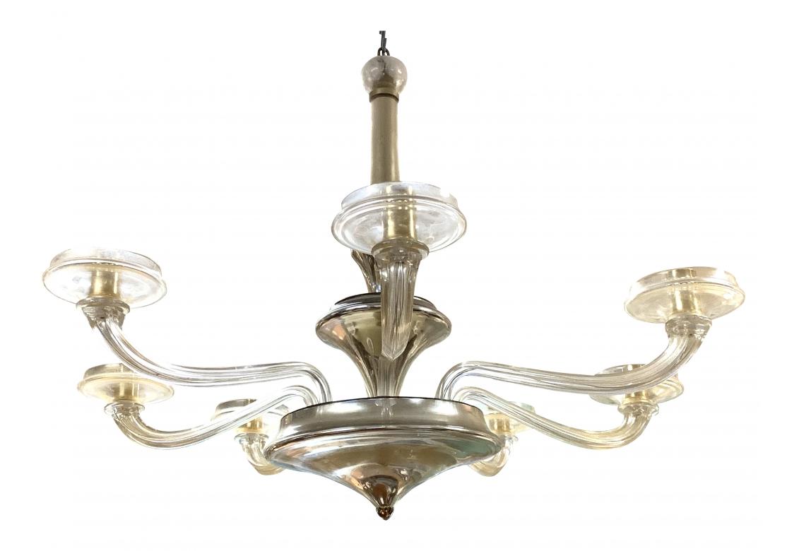 A vintage vetri d'arte Murano 6 arm chandelier more than likely designed by Seguso for Donghia. The chandelier with a graduated baluster form standard similar to mercury glass, capped with a sphere that conceals the hook and terminating with a gold