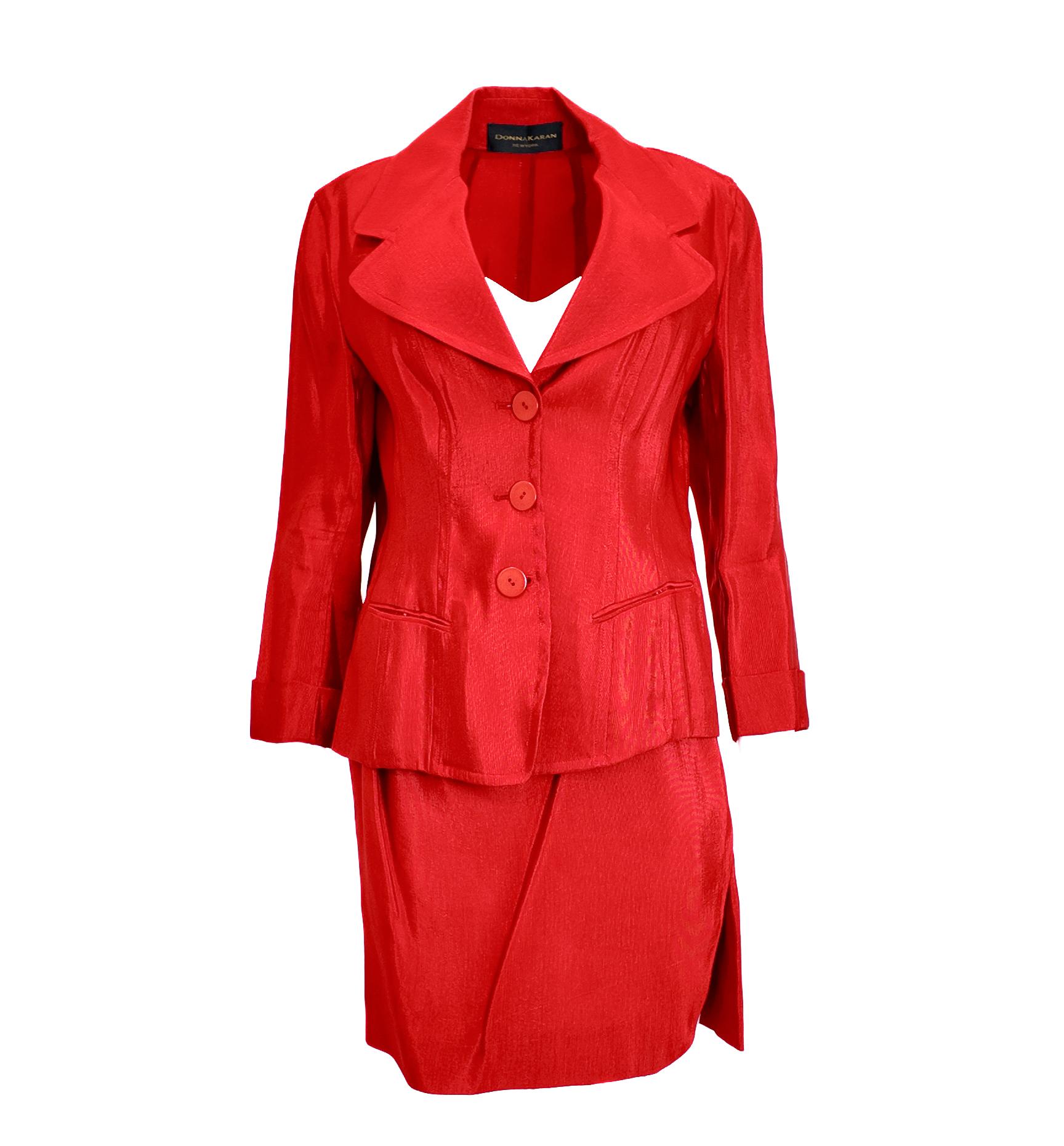 Step into bold confidence with the Donna Karan Red Sheen Skirt Suit. Its striking red hue with a subtle sheen commands attention, making it the perfect power suit for any professional setting. Designed to empower, this suit combines classic