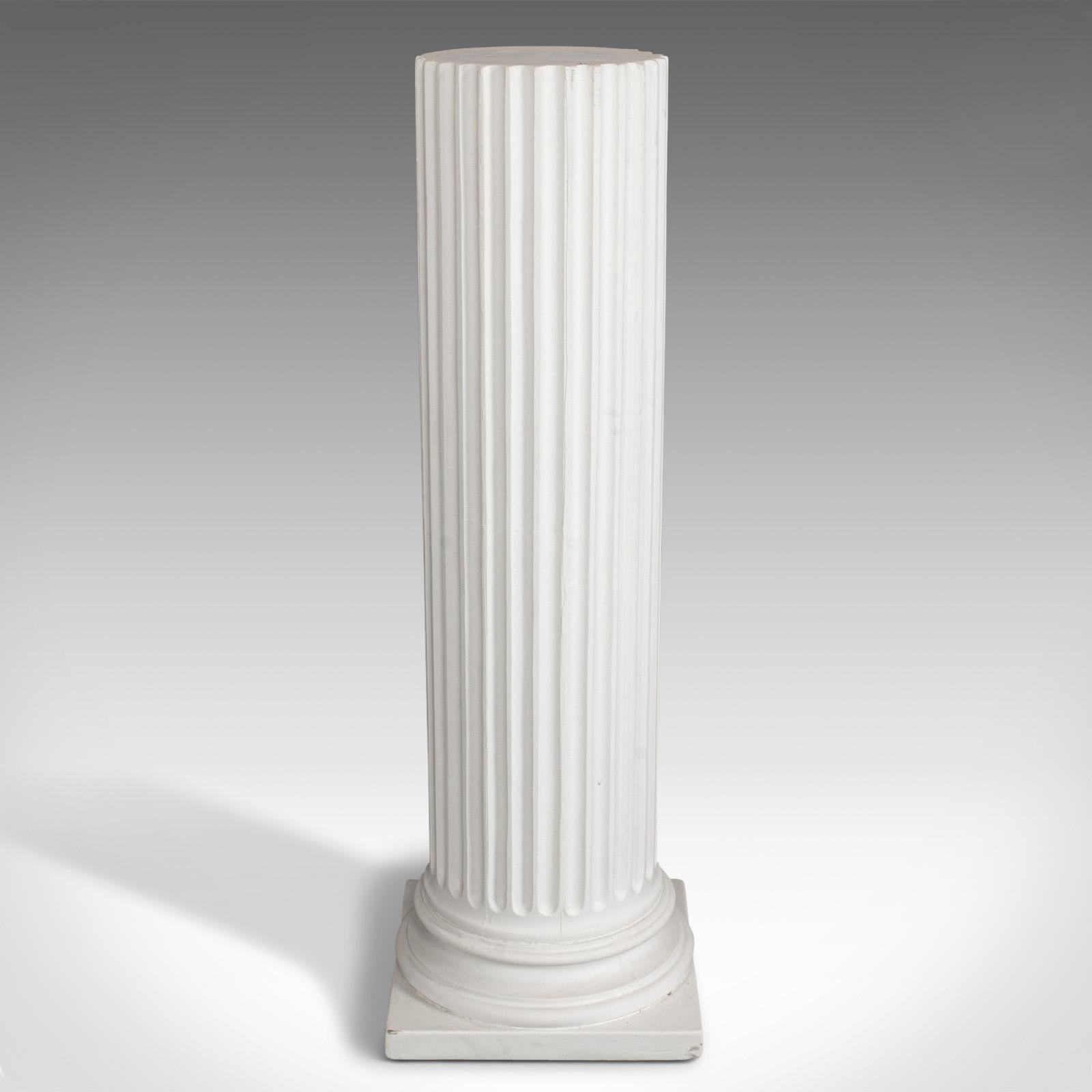 This is a vintage Doric column. A English, architectural plaster display base in classical form, dating to the late 20th century.

Pleasing, versatile pillar in classical taste
Displays a desirable aged patina
Some marks to corners of