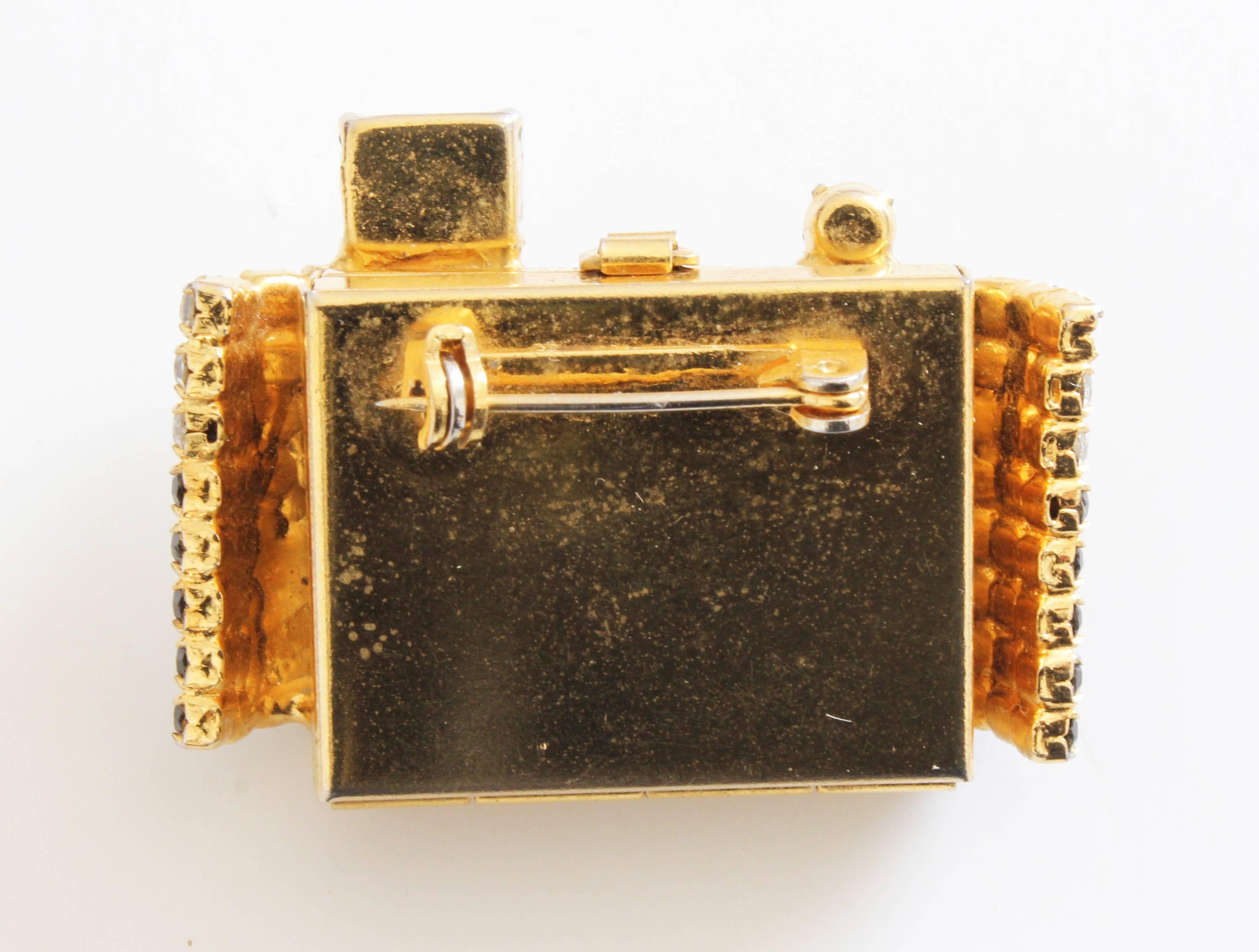 camera brooch