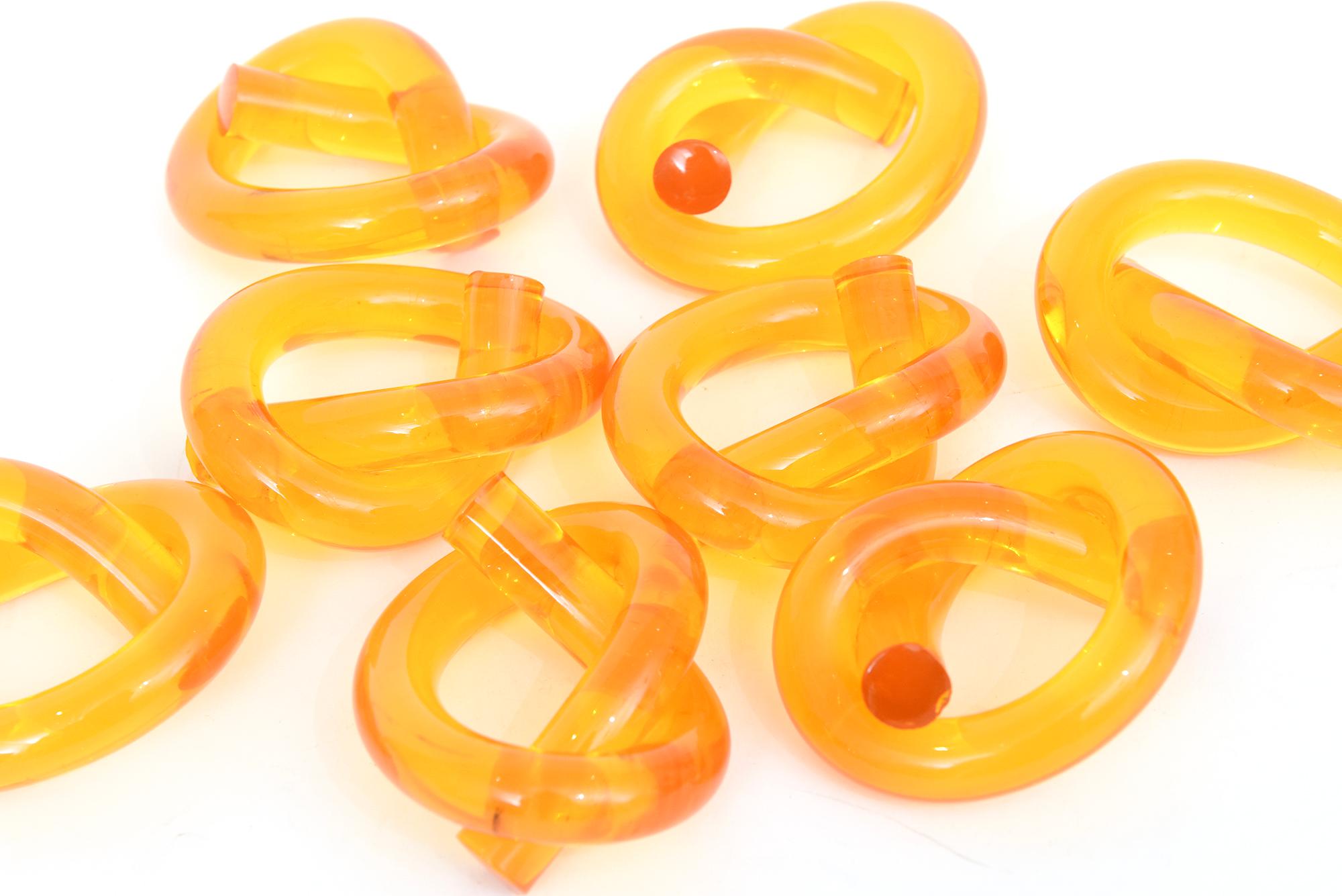 Modern Vintage Dorothy Thorpe Amber Lucite Twisted Pretzel Napkin Rings Set of Eight For Sale