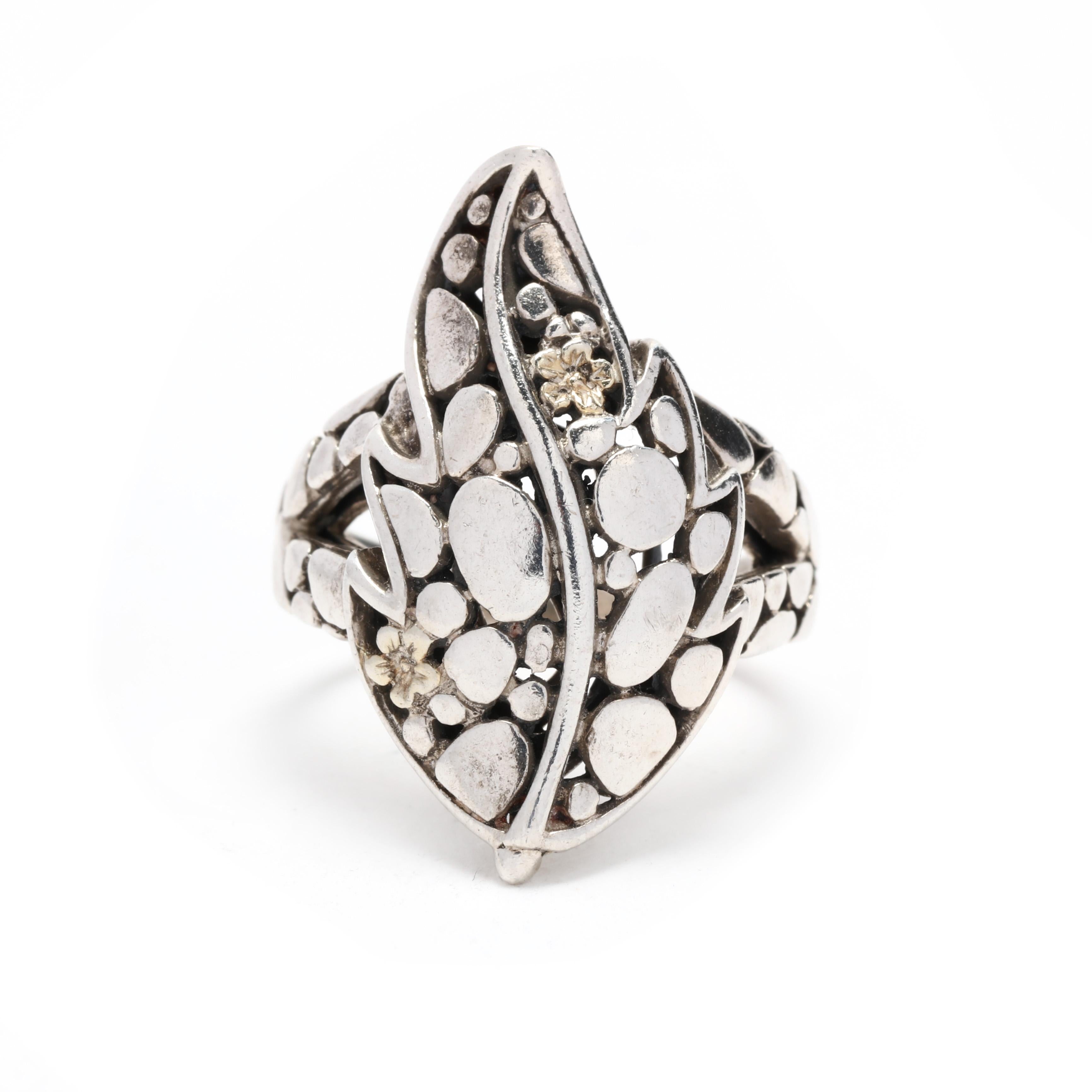 A vintage sterling silver dot leaf motif statement ring. This long silver ring features a leaf design with a dot and floral motif throughout and a split band.

Ring Size  8

Length: 1 1/8 in.

Weight: 5.45 dwts. / 8.5 grams

Ring Sizings &