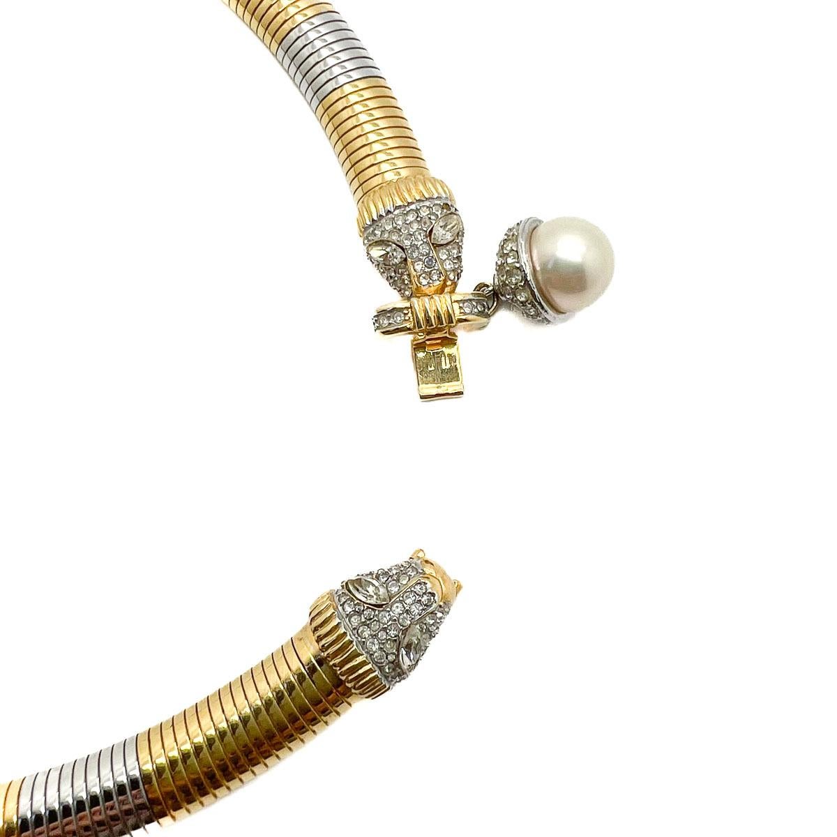 A fabulous Vintage Big Cat Omega Collar. A wonderfully designed collar with plenty of sass. Featuring a double big cat head set with crystals, the quintessential pearl drop and a full gas pipe collar in mixed metals. With its concealed clasp this is