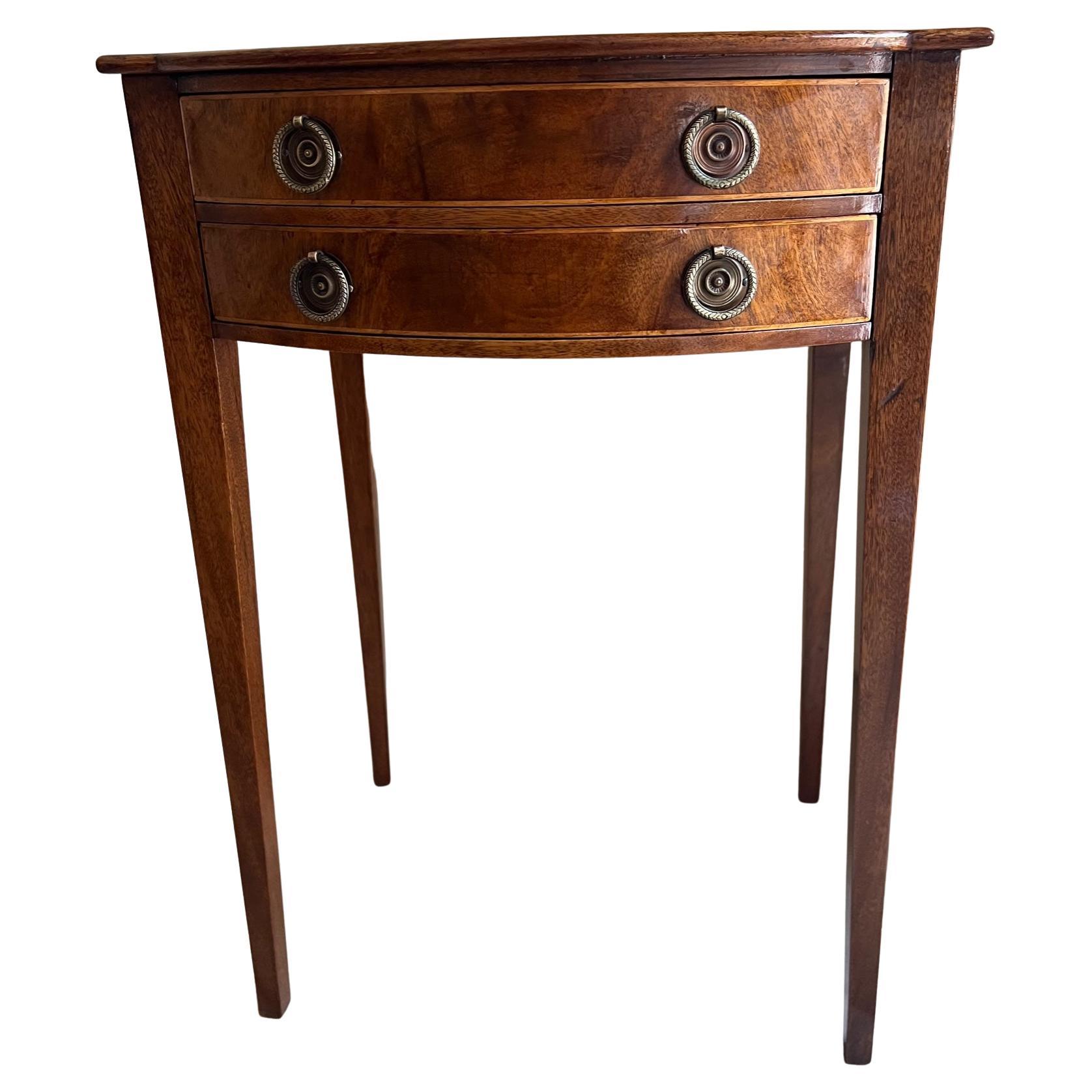 Vintage Federal style double drawer side table with inlaid wood on the drawers, made in the 1930s to 1940s.