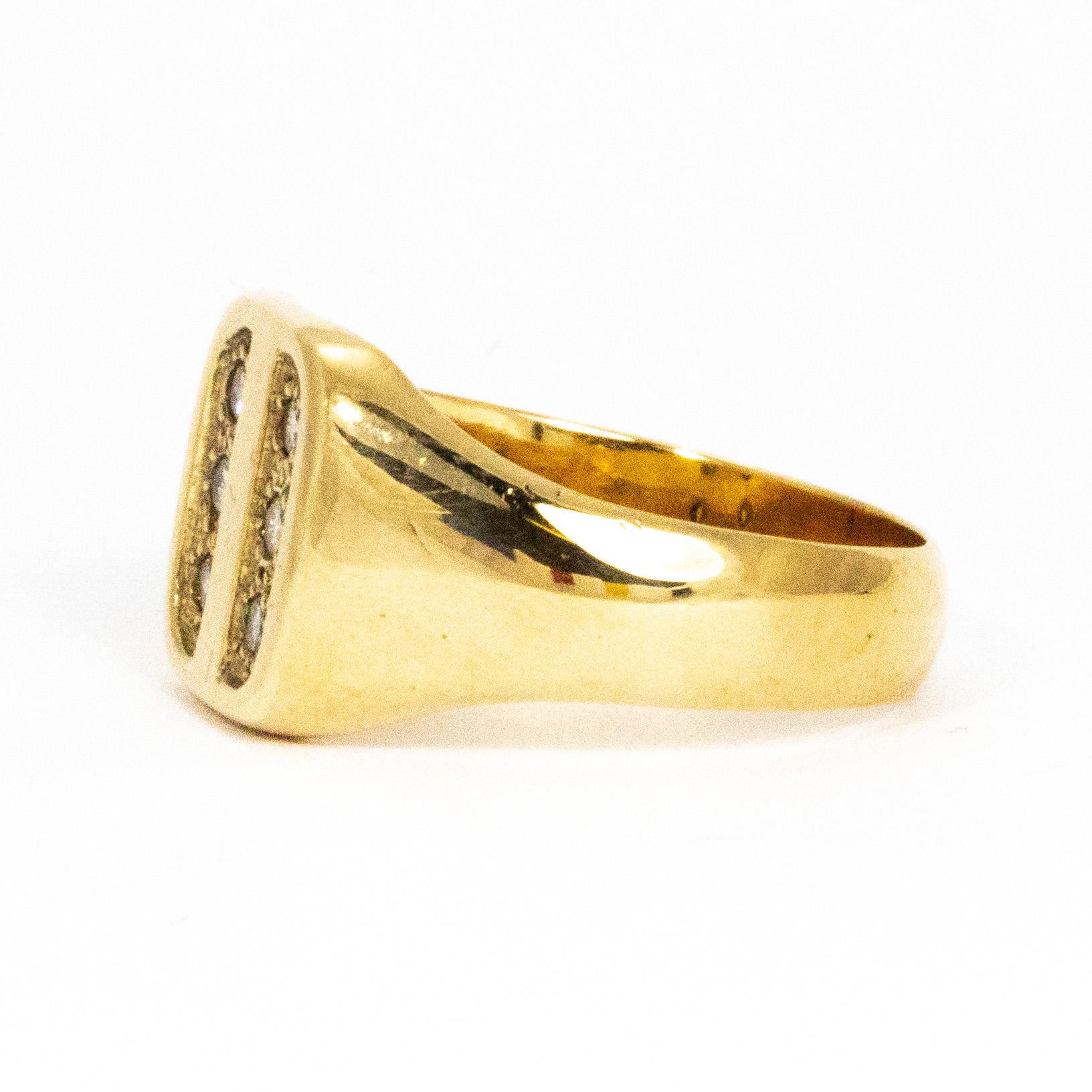 The gorgeous sparkling diamonds that sit in two rows of three measure 4pts each and add the perfect amount of sparkle to the chunky glossy gold ring. Modelled in 18ct gold, this signet ring is a real show stopper!

Ring Size: T or 9 1/2
Ring Width: