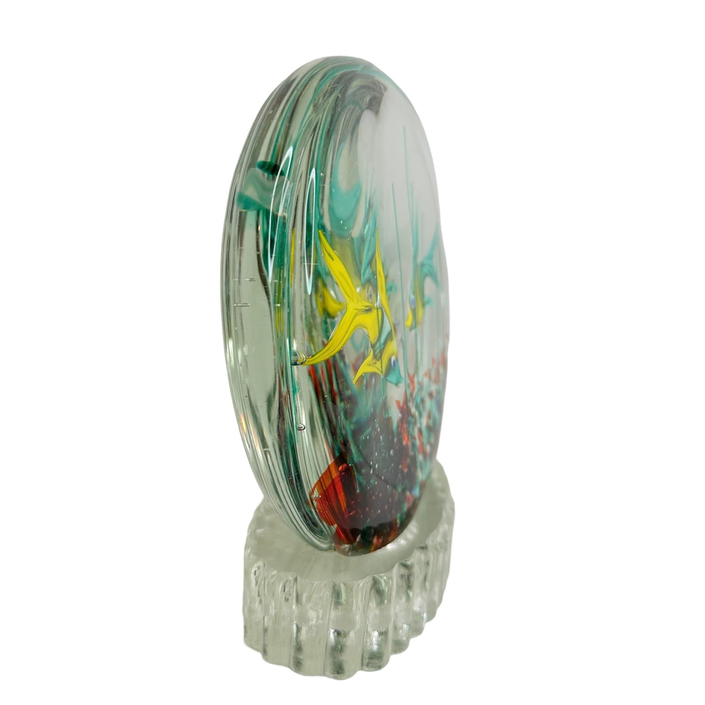 Beautiful Murano hand blown aquarium Italian art glass sculpture. Showing two fish in a reef. Colors are different shades of green, red, Yellow and clear. Created in the manner of designer Riccardo Licata. The fish are sandwiched in glass layers,