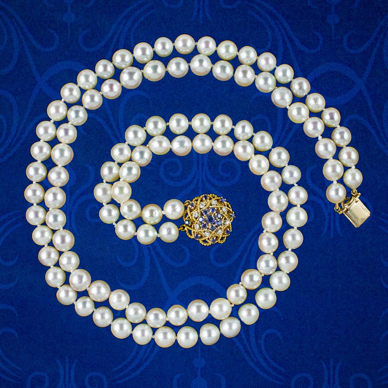 A classy vintage pearl matinee necklace from the late 20th Century displaying two strands of luxurious, creamy-white cultured pearls that are exceptionally bright with a smooth glossy surface.   

Pearls are the birthstone of June and a true
