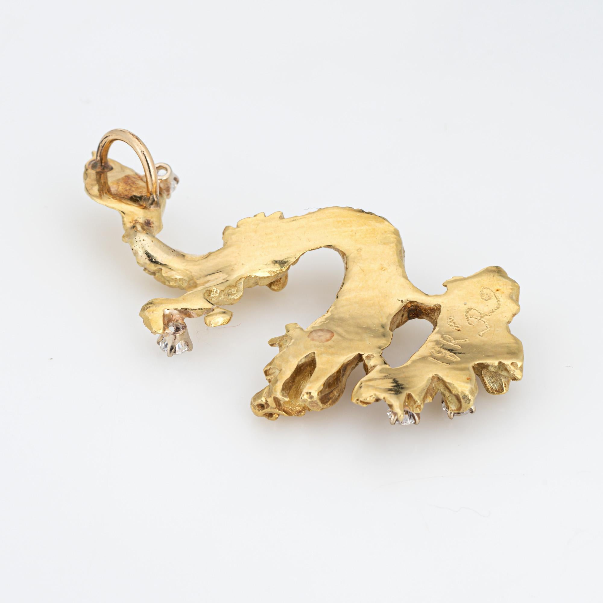 Unique & stylish vintage dragon pendant (circa 1960s to 1970s) crafted in 18 karat yellow gold. 

5 diamonds total an estimated 0.50 carats (estimated at I-J color and SI1-I1 clarity).   

The elaborate dragon features realistic scale like detailing
