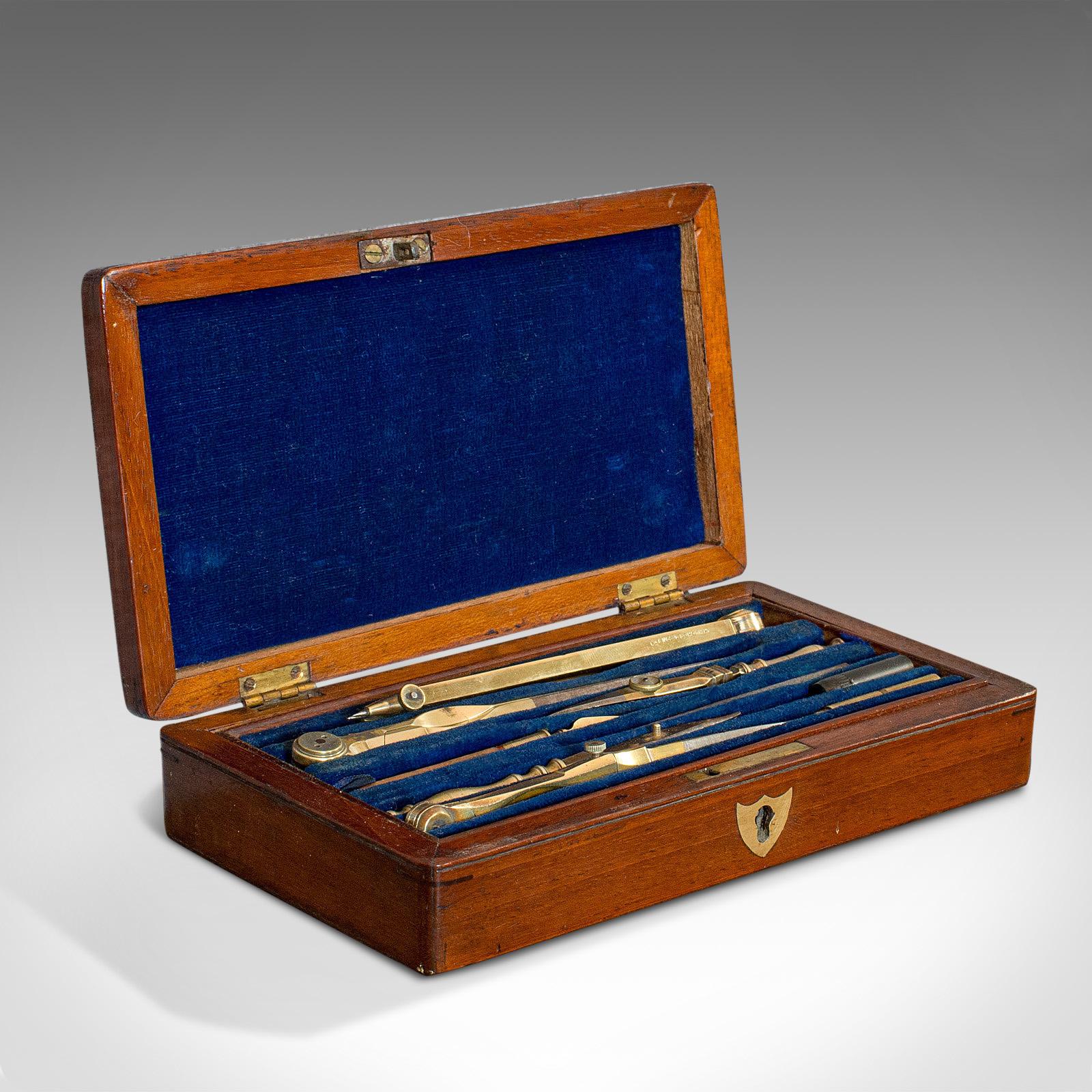 This is a vintage draughtsman's instrument set. An English, brass drawing or navigation tool compendium by Henry Hughes & Son, dating to the mid-20th century, circa 1940.

Pleasingly presented instrument set
Displays a desirable aged