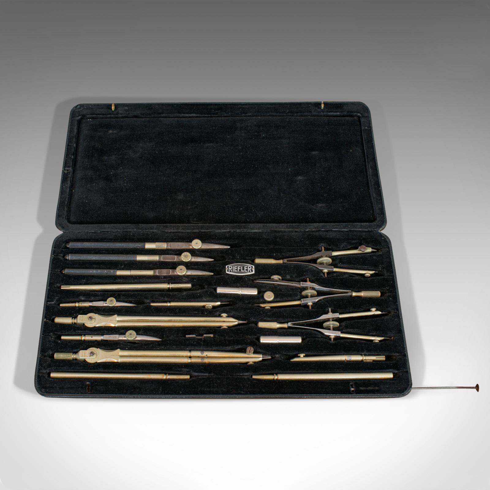 This is a vintage draughtsman's set. A German, nickel silver drawing instrument set by Riefler, dating to the mid-20th century, circa 1950.

Nineteen-piece instrument set
Displays a desirable aged patina
Silver nickel tools in good