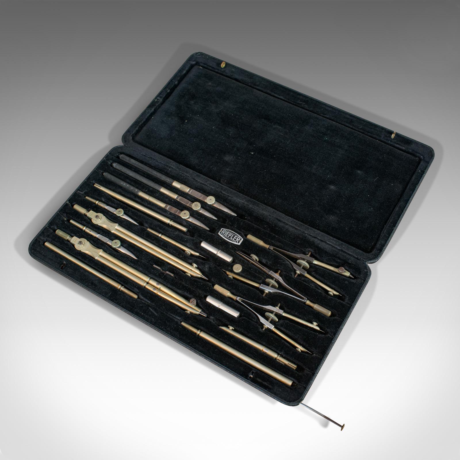 a set of draughtsman drawing instruments