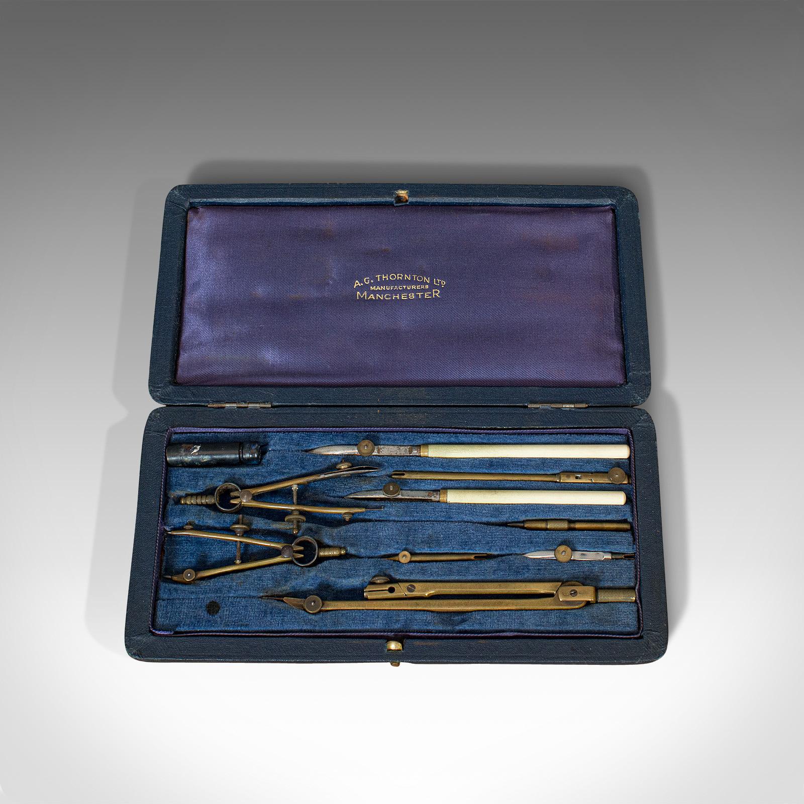 This is a vintage draughtsman's technical drawing case. An English, brass and silver nickel instrument set, dating to the early 20th century, circa 1930.

Useful set of instruments with appealing finish
Displaying a desirable aged patina
Brass