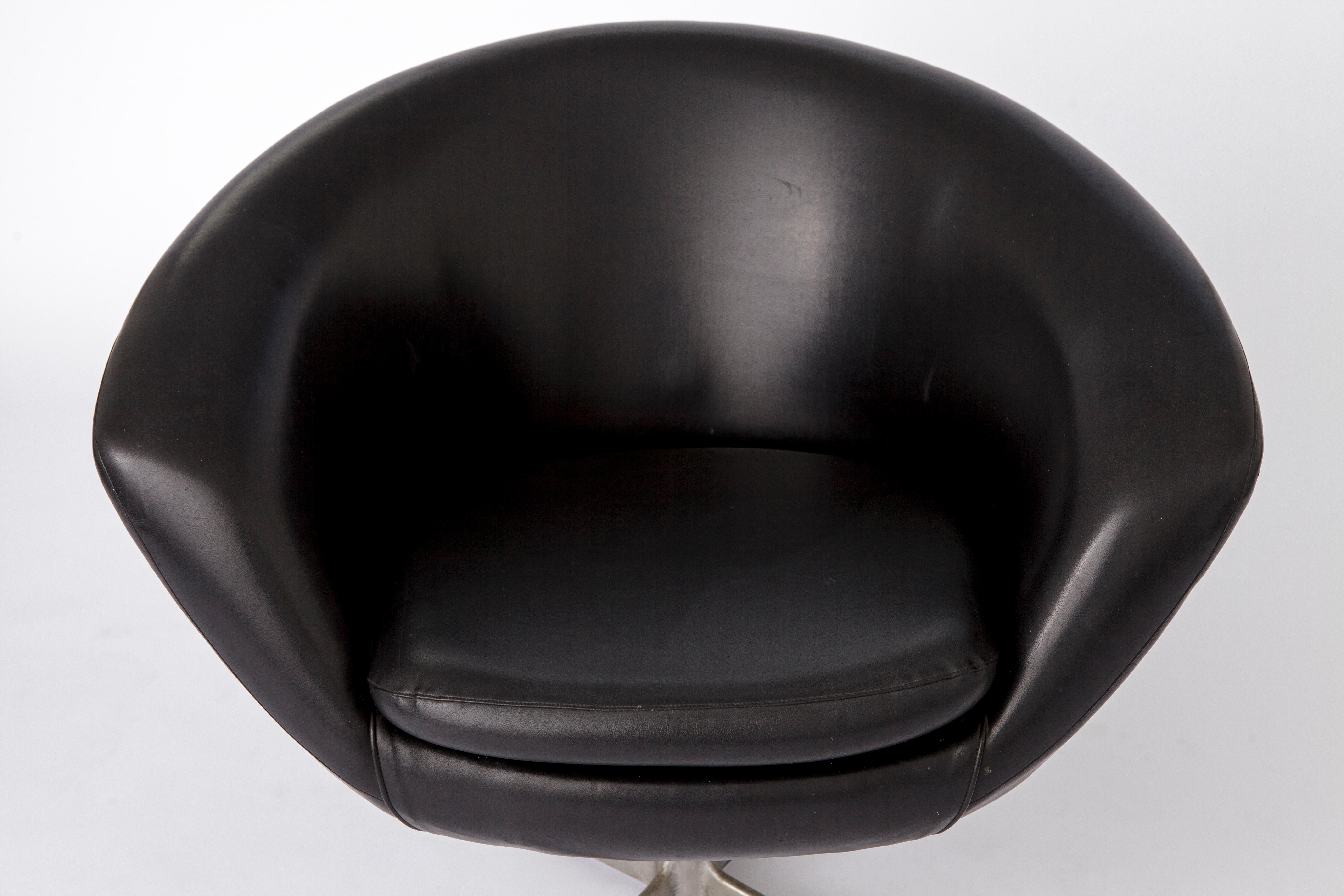 Vintage easy chair from the 1960s. 
Manufacturer: Overman, Sweden. 

Good vintage condition. Ultra light weight, total weight is under 10 kg. 
Black artificial leather (skai) material in good condition without defects. 