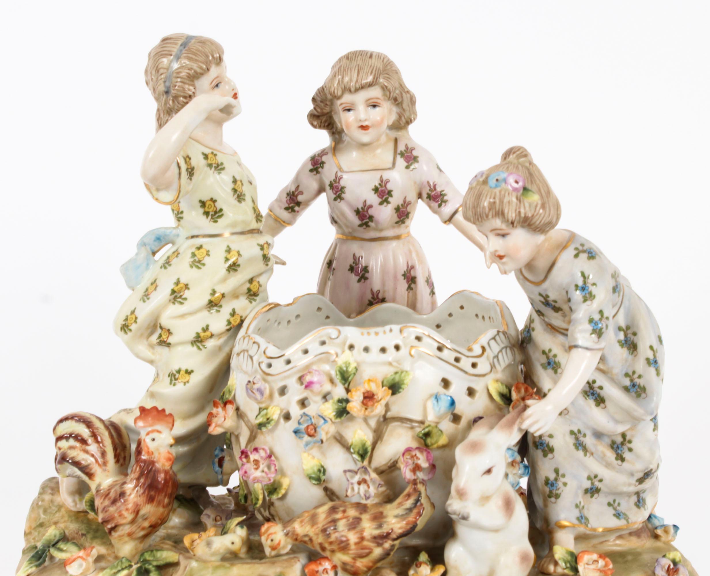 This is truly delightful Vintage classical porcelain centrepiece in the Dresden manner, dating from the last quarter of the 20th century.

This stunning centrepiece is hand-painted with an array of bright colours. It features three charming girls