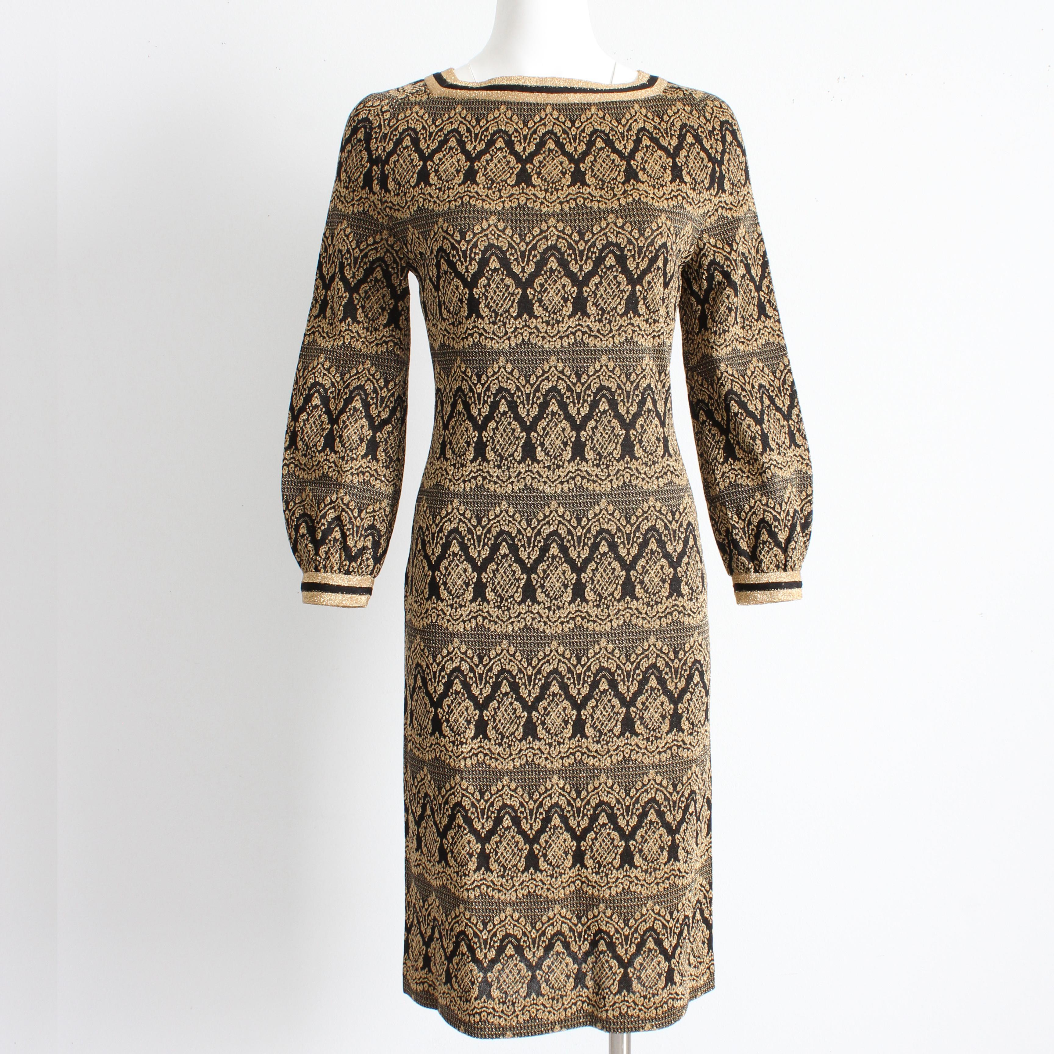 Vintage knit dress by Bobette Imports France, likely made in the late 60s. Made from black and gold metallic Lurex knit, it features a mod Moroccan-inspired pattern throughout, with rear zip and hook/eye fastener and peasant sleeves. Unlined/no