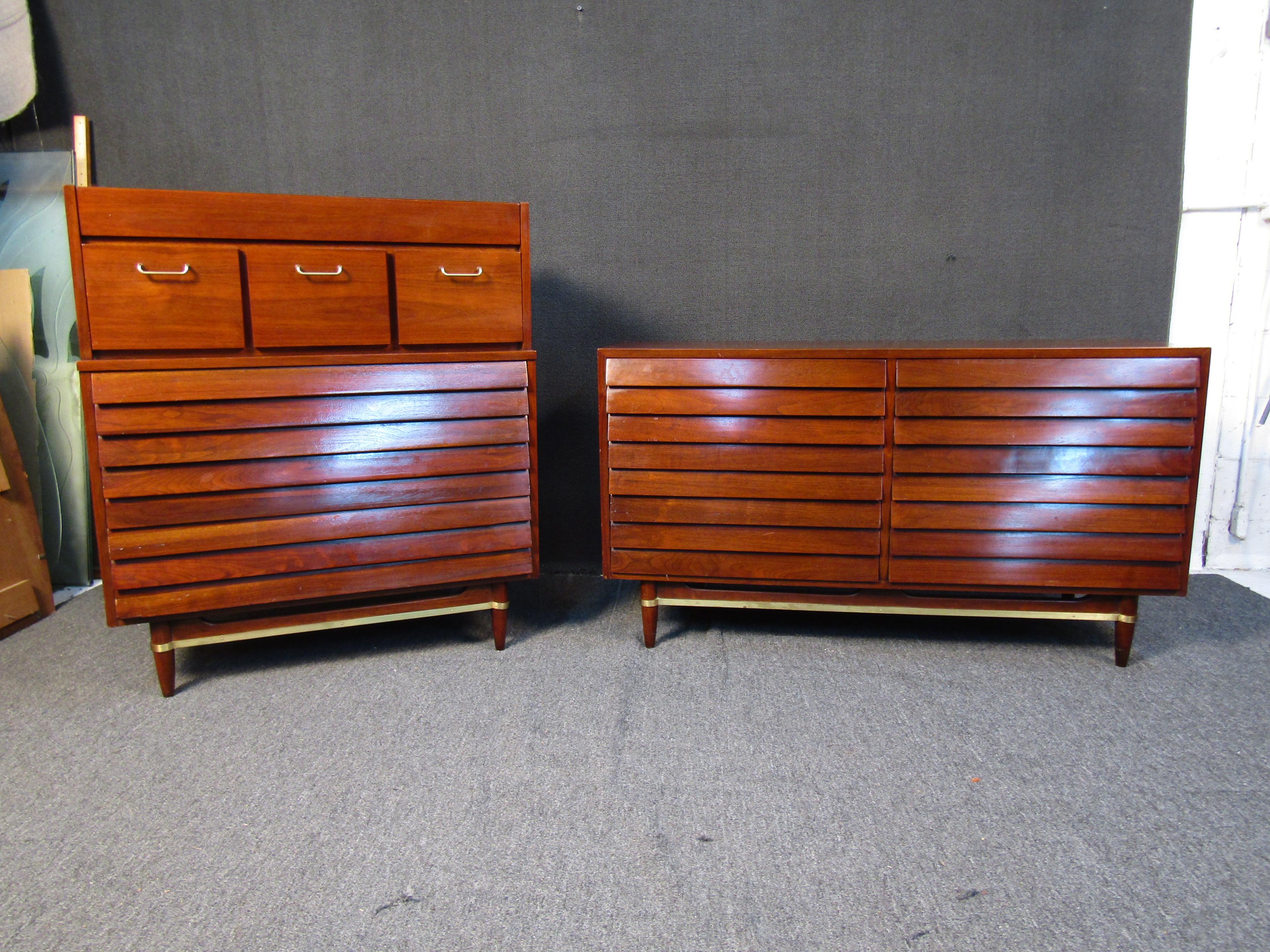 With a classic Mid-Century Modern design and rich walnut woodgrain, this dresser and highboy set by American of Martinsville can add timeless style to any bedroom. Large drawers allow for storage and organization. Please confirm item location with