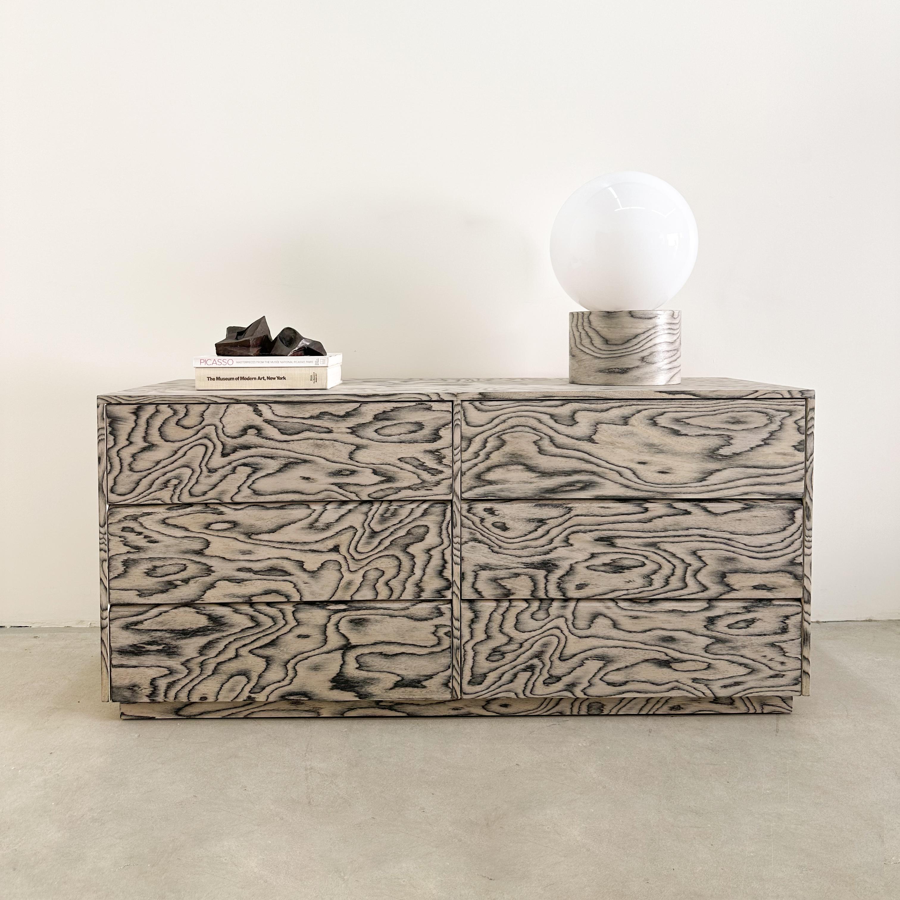 This vintage dresser features re-veneering with the original ALPI veneer, designed by Ettore Sottsass in 1985 an iconic figure in the Memphis design movement.
Its distinctive veneer has been sealed with a satin finish to enhance durability. 