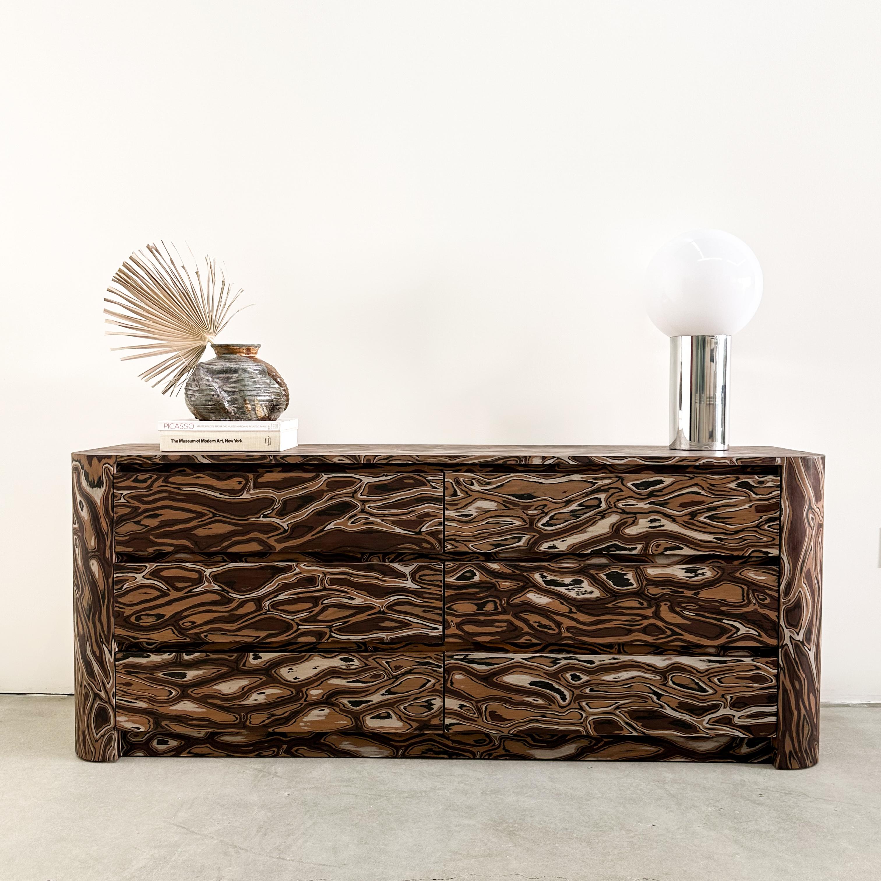 Vintage Dresser Featuring Kengo Kuma Veneer.

The vintage dresser has been meticulously re-veneered, featuring the original design by Kengo Kuma, a renowned architect recognized for his adept use of natural materials to craft contemporary spaces