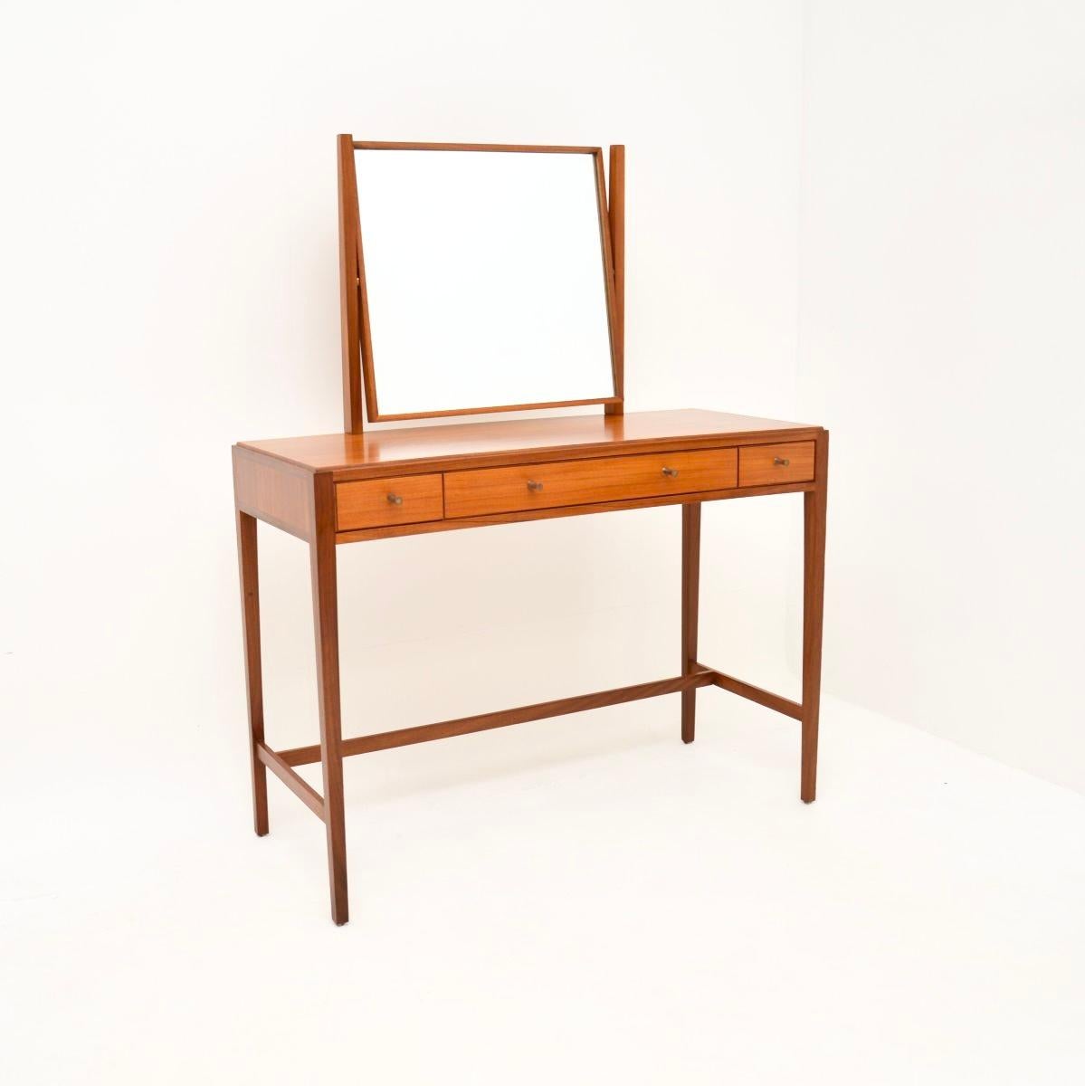 A stylish and very well made vintage dressing table and stool by Loughborough. They were made in England, and date from the 1950’s.

The quality is outstanding, these are beautifully designed and are a lovely, petite size. The wood has a gorgeous