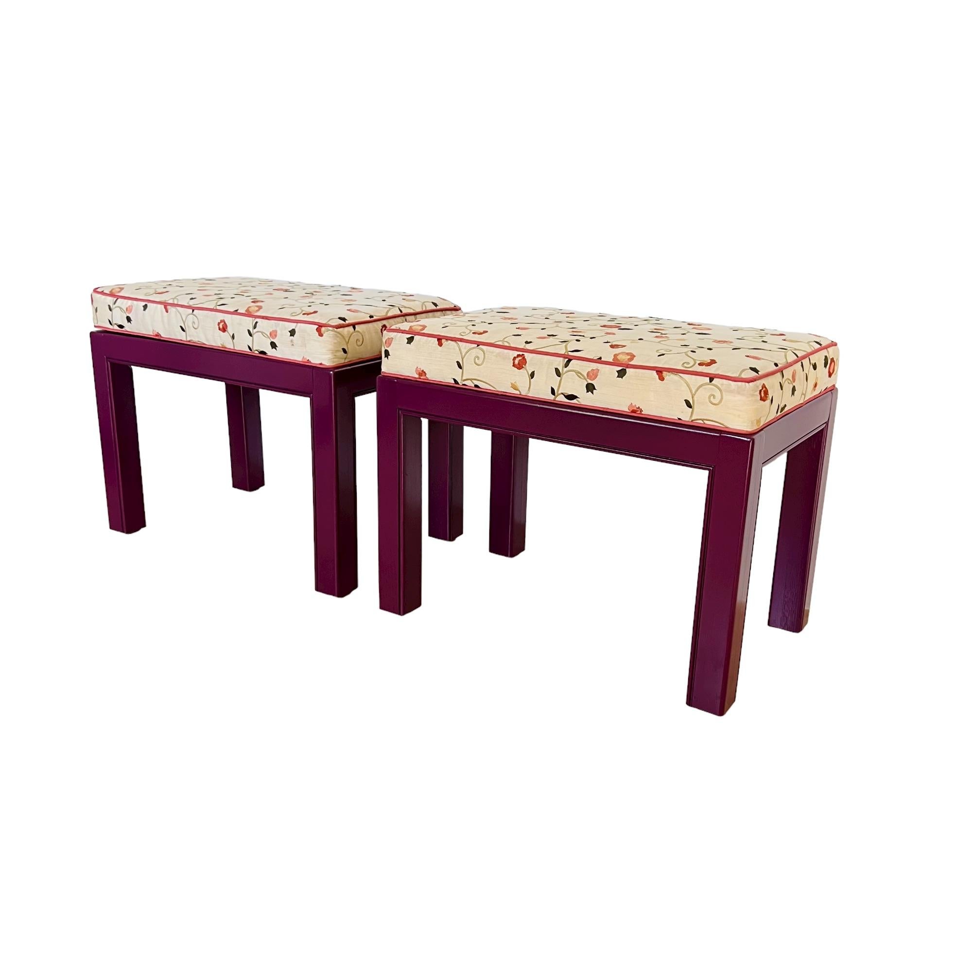 A late 20th century pair of Drexel Heritage Chippendale style custom upholstered and painted benches or ottomans. These petite eclectic seats/stools features channelled wood aprons and legs updated in a semi-gloss aubergine (eggplant) color. The