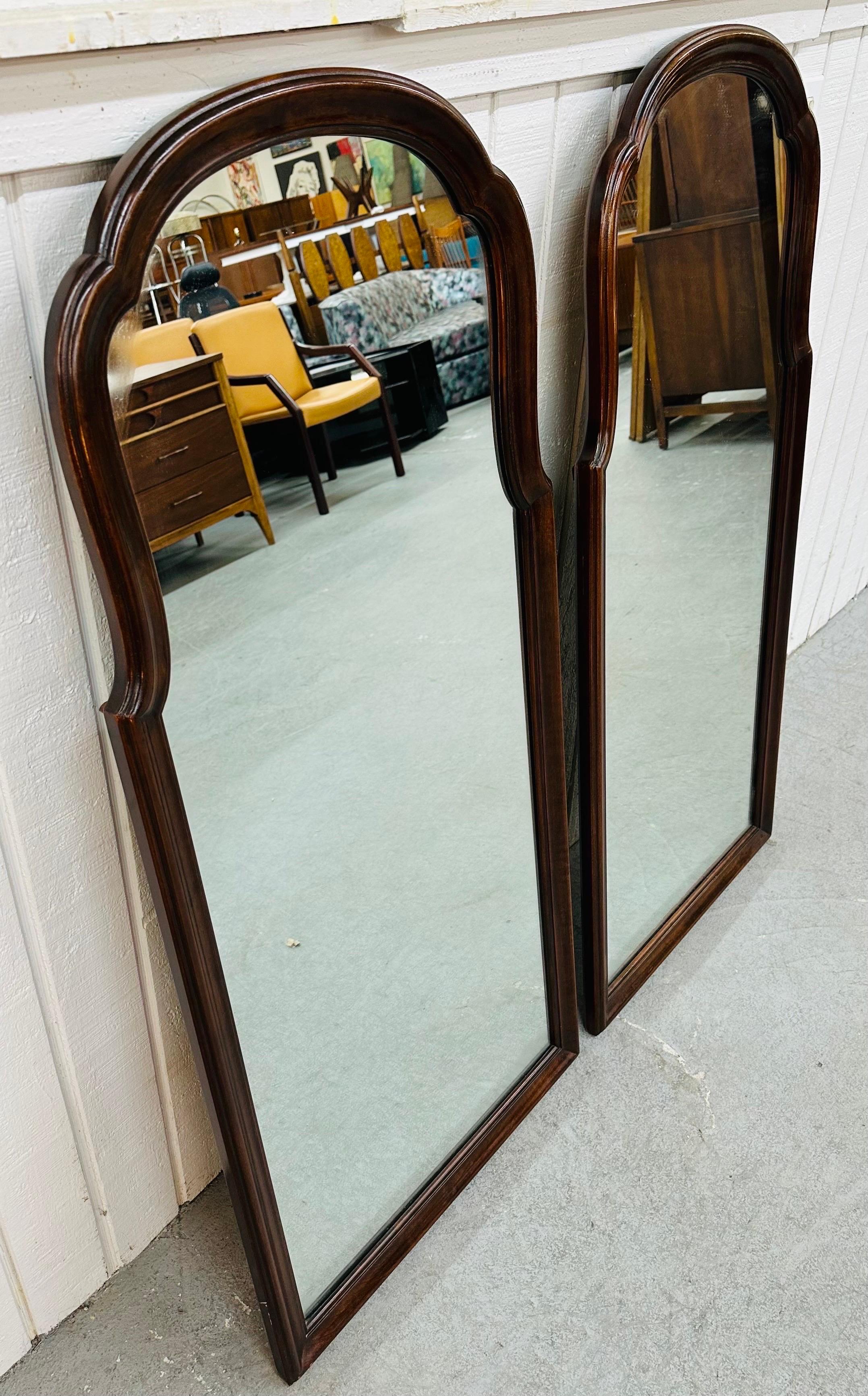 This listing is for a pair of vintage Drexel Heritage Mahogany Wall Mirrors. Featuring an antique style design, solid cherry wood frames, and a beautiful mahogany finish. This is an exceptional combination of quality and design by Drexel Heritage!