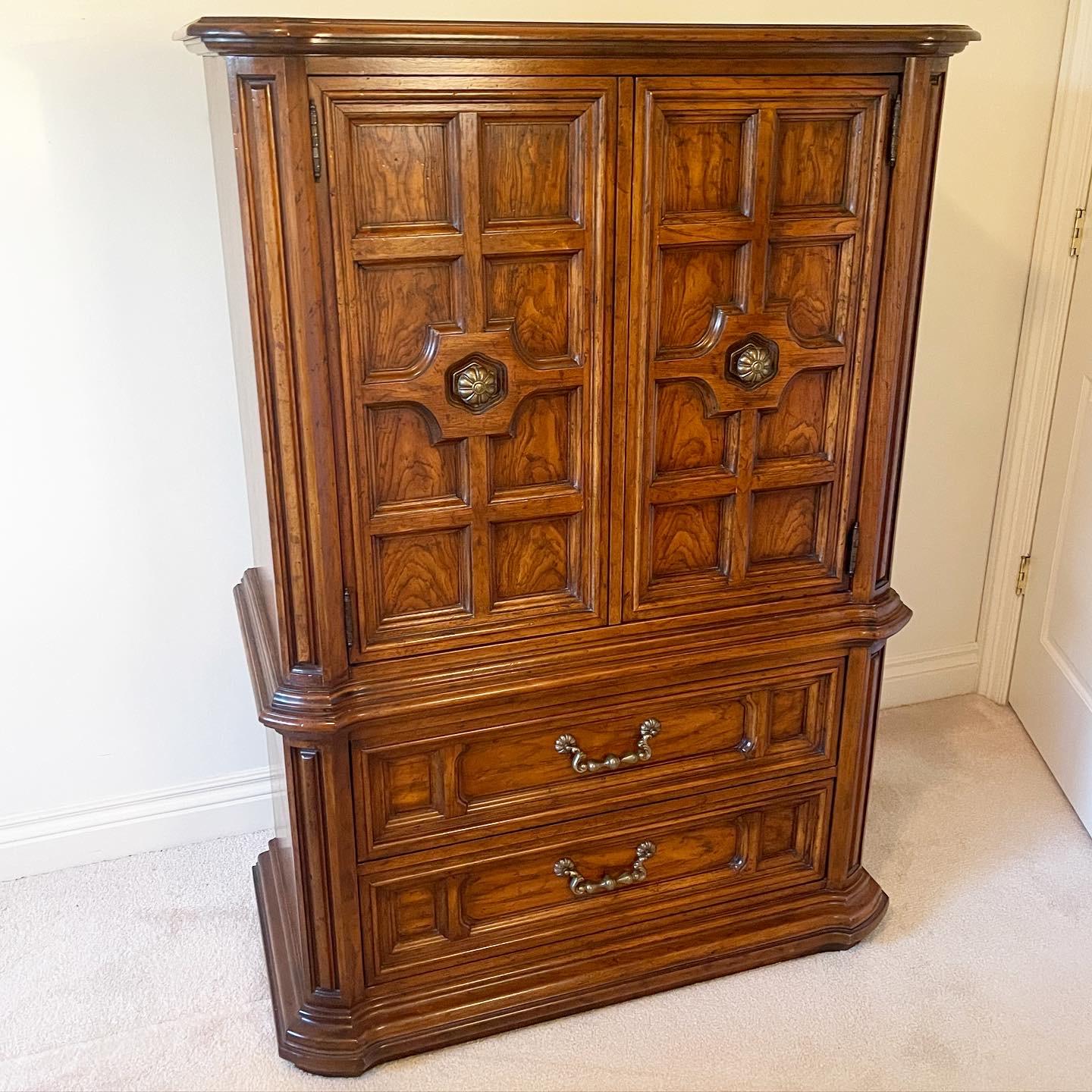 Incredible vintage Maracay armoire by Drexel Heritage. Features two large spacious drawers and two ornate cabinet doors which open to reveal shelving with drawers.