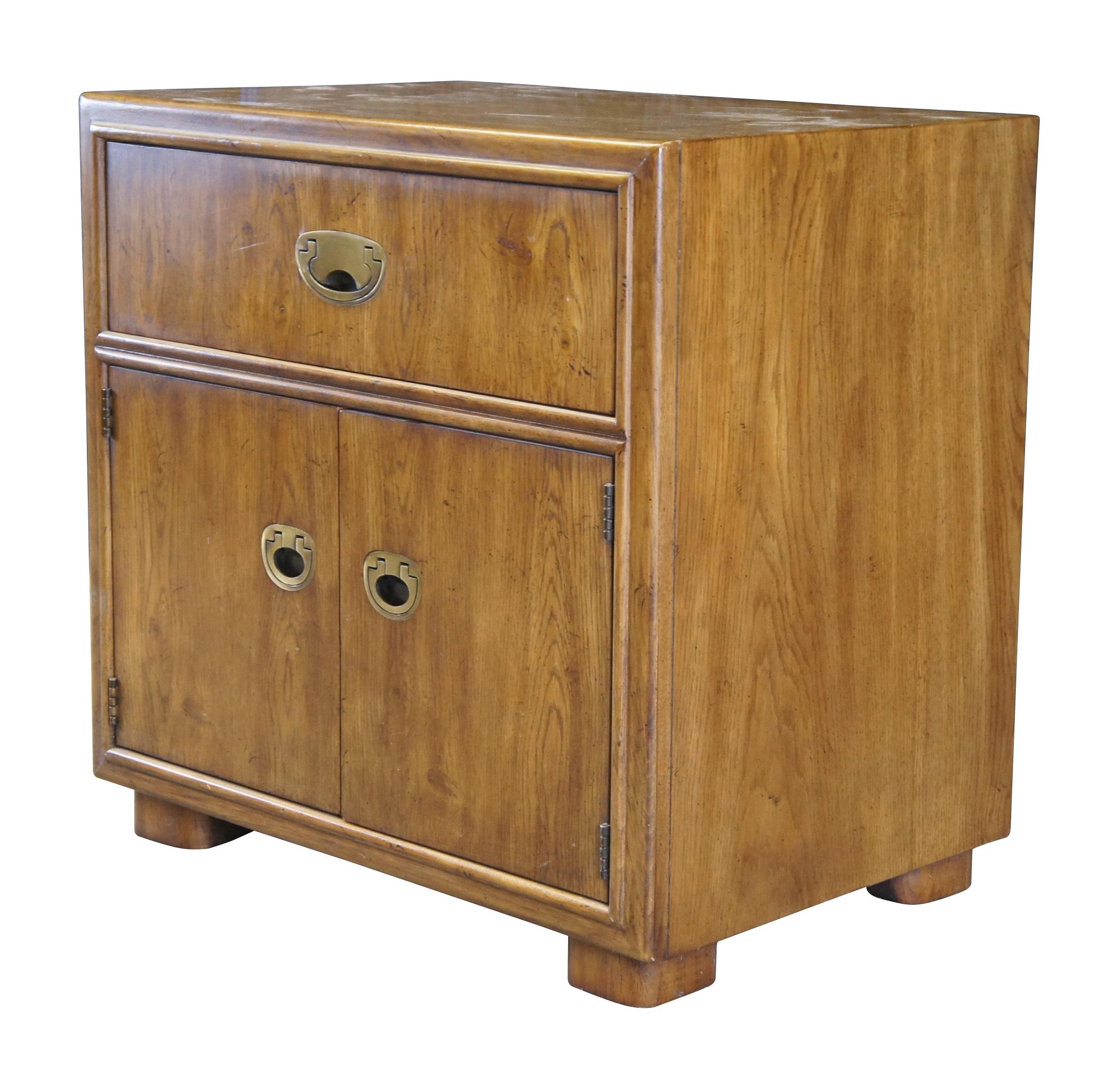 Drexel Heritage Passage Collection nightstand or end table, circa 1987, no 915-630-2.  Features a rectangular frame made from oak with a dovetailed drawer over lower cabinet with inset brass drawer pulls.  A great addition to any mid century modern