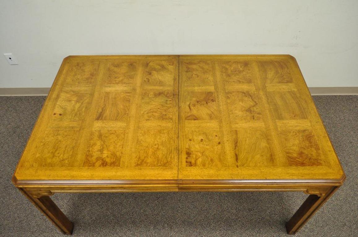 Vintage dining table from the Drexel Heritage sketchbook collection with two leaves. Item features banded burl wood parquetry top, thick Parsons style legs, two - 20