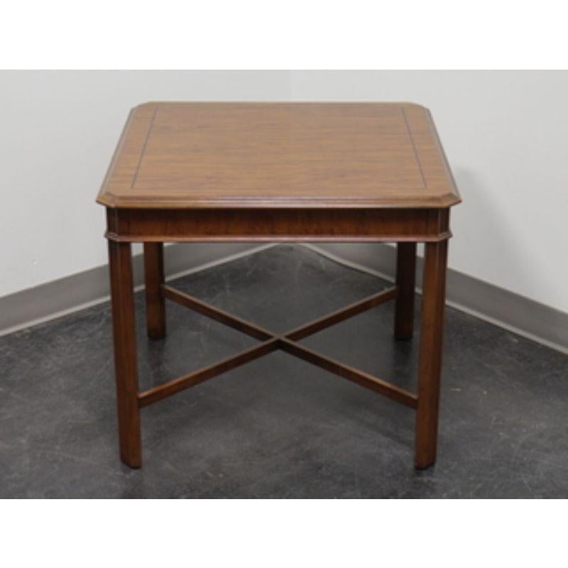 A Chippendale style accent table in Yew wood by Drexel Heritage from their Yorkshire collection. Features inlaid banding on top, straight legs joined by stretchers. Made in the USA, in the late 20th century.

Measures: 27 W 27 D 23.25