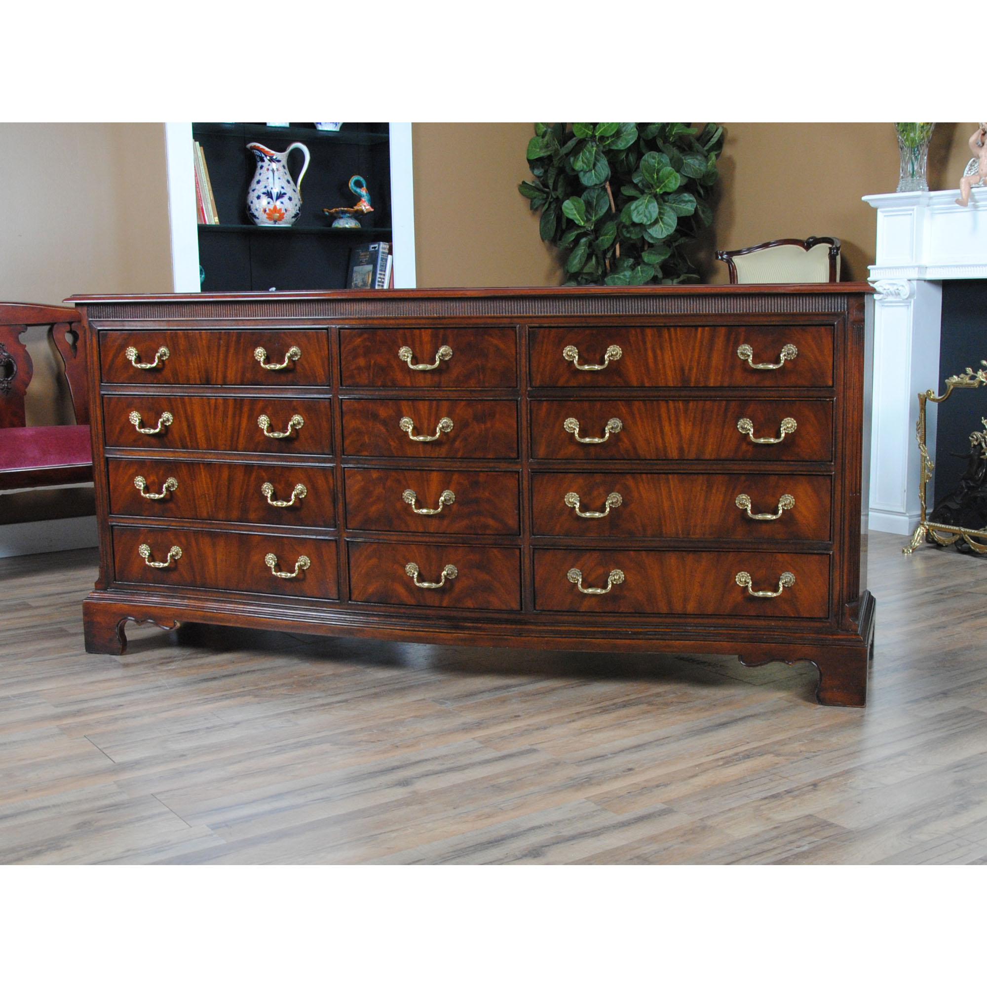 A Vintage Drexel Mahogany Triple Dresser. A classic furniture shape this serpentine chest features three drawers across and four drawers high to give this large dresser an elegant and traditional furniture appearance that is both functional and