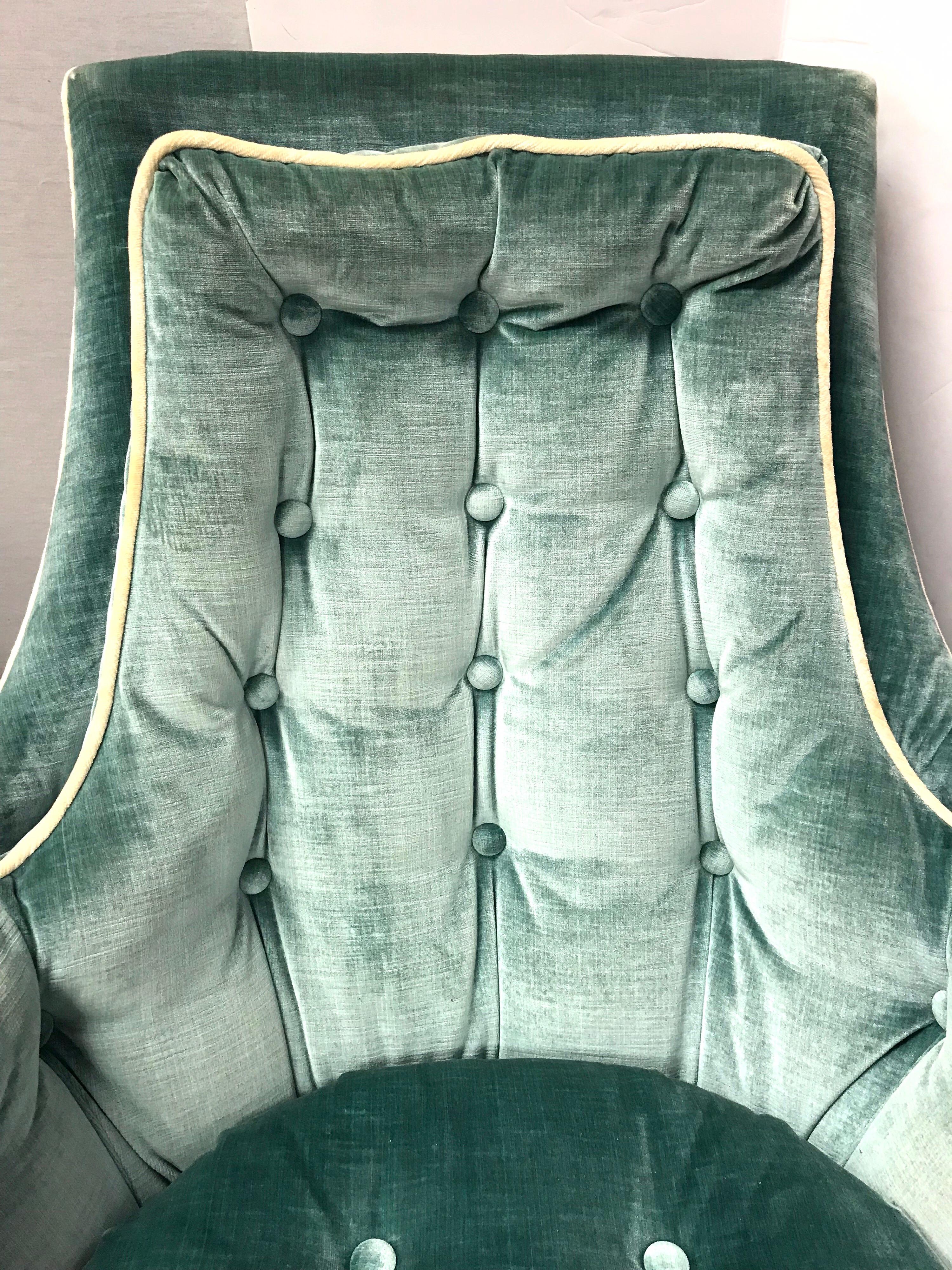 Midcentury 1960s velvet lounge chair with button tufted back and tufted seat in a beautiful robin’s egg blue color. Chair rocks and swivel 360 degrees and is super comfortable.