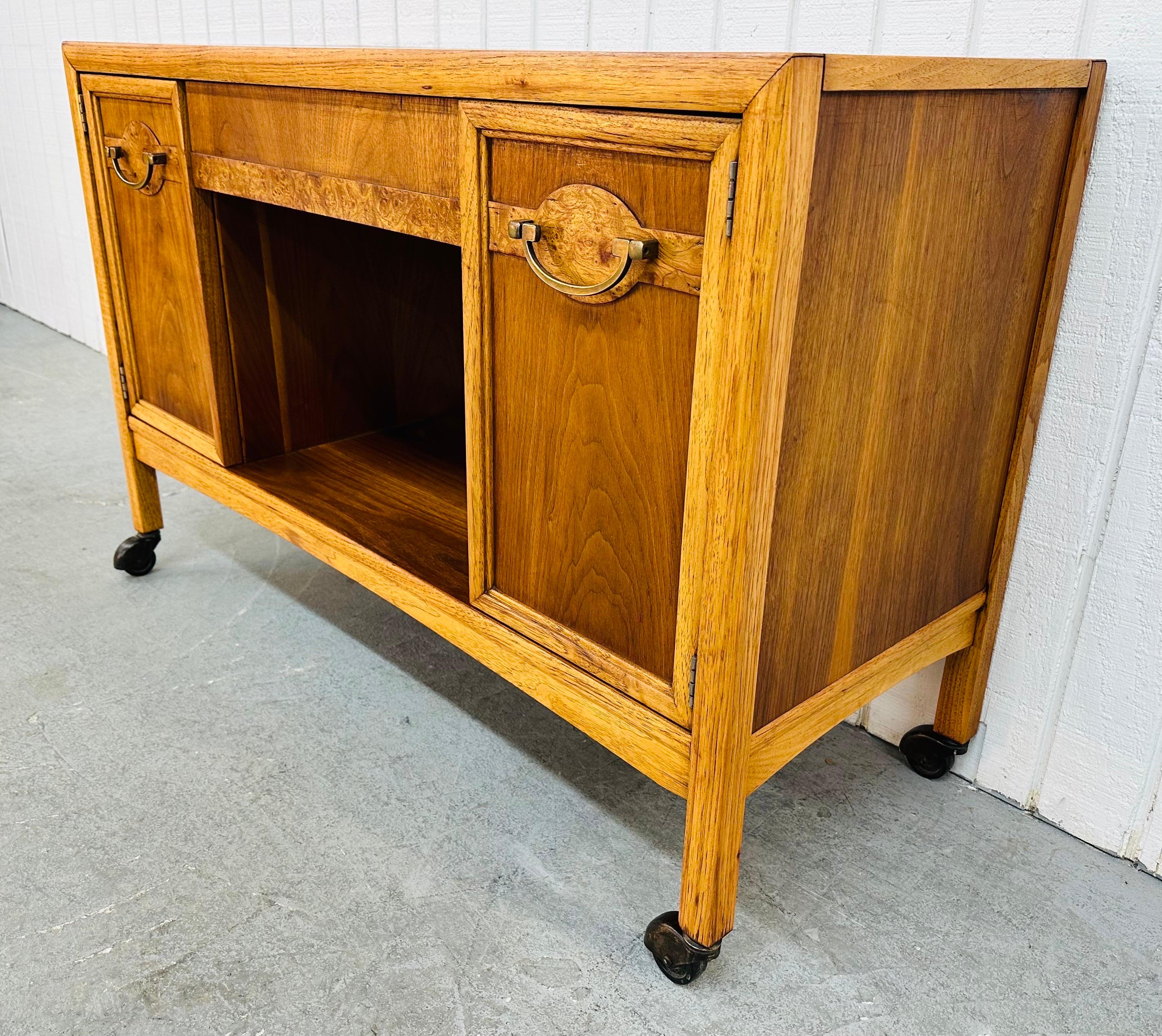 This listing is for a vintage Drexel Walnut Serving Cart. Featuring a straight line design, rectangular top, center drawer, two doors that open up to storage space, open space under the drawer for more storage, original hardware, wheels for easy