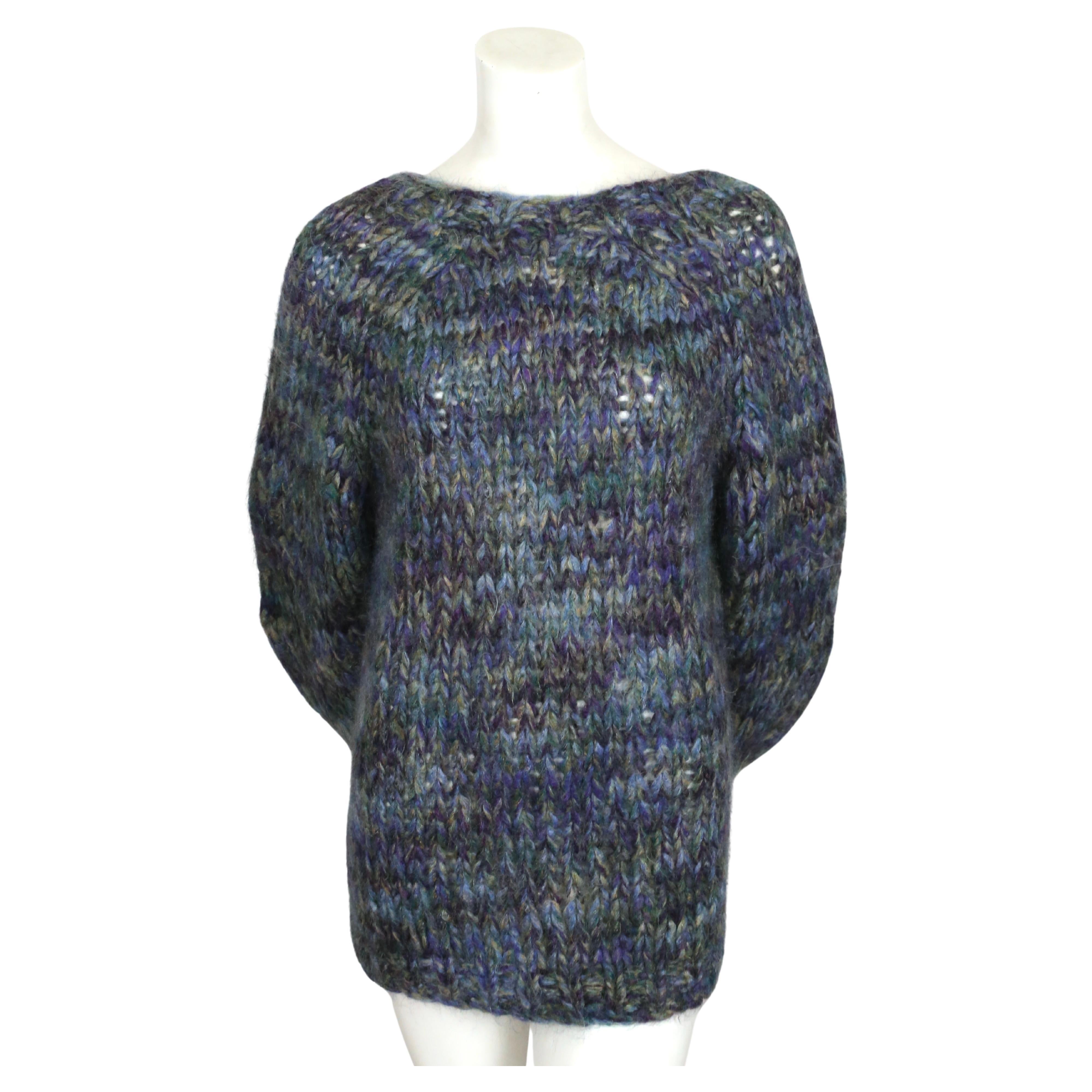 Blue and green fuzzy oversized sweater with bell sleeves and V-back by Dries Van Noten dating to the 2000's.   Size XS. Very oversized fit. Sweater has a loose weave with a heavy gauge knit however the fabric is soft and light.  Fabric content: 43%