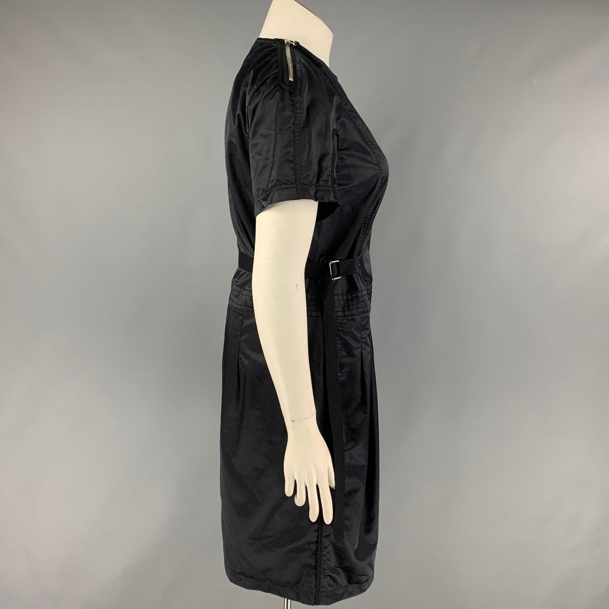 Vintage DRIES VAN NOTEN dress comes in a navy blue cotton featuring a adjustable waist, short sleeves, and a shoulder zip up closure.
Very Good
Pre-Owned Condition. 

Marked:   42 

Measurements: 
 
Shoulder: 17 inches  Bust: 38 inches  Waist: 38