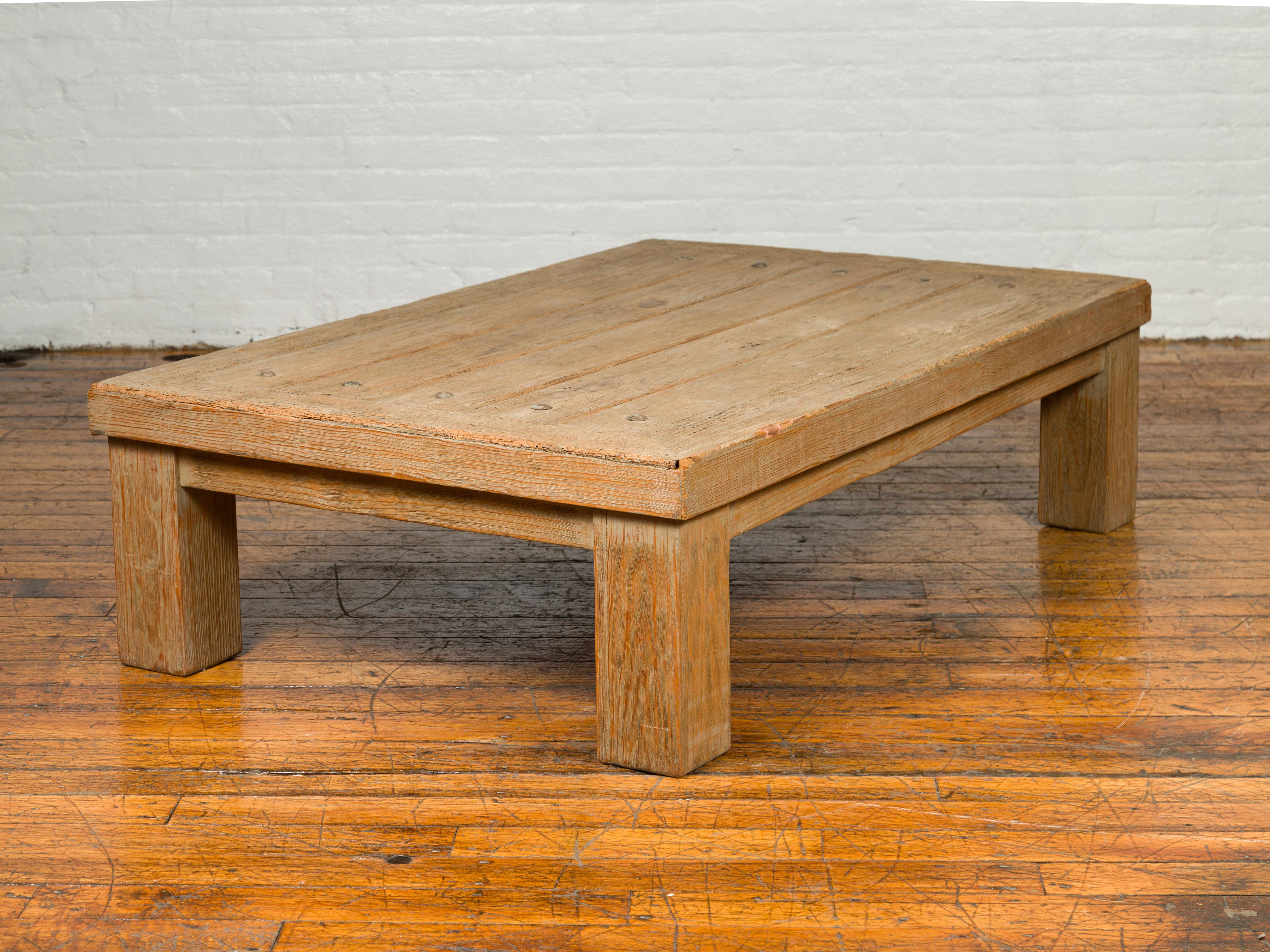 wooden coffee table with metal studs